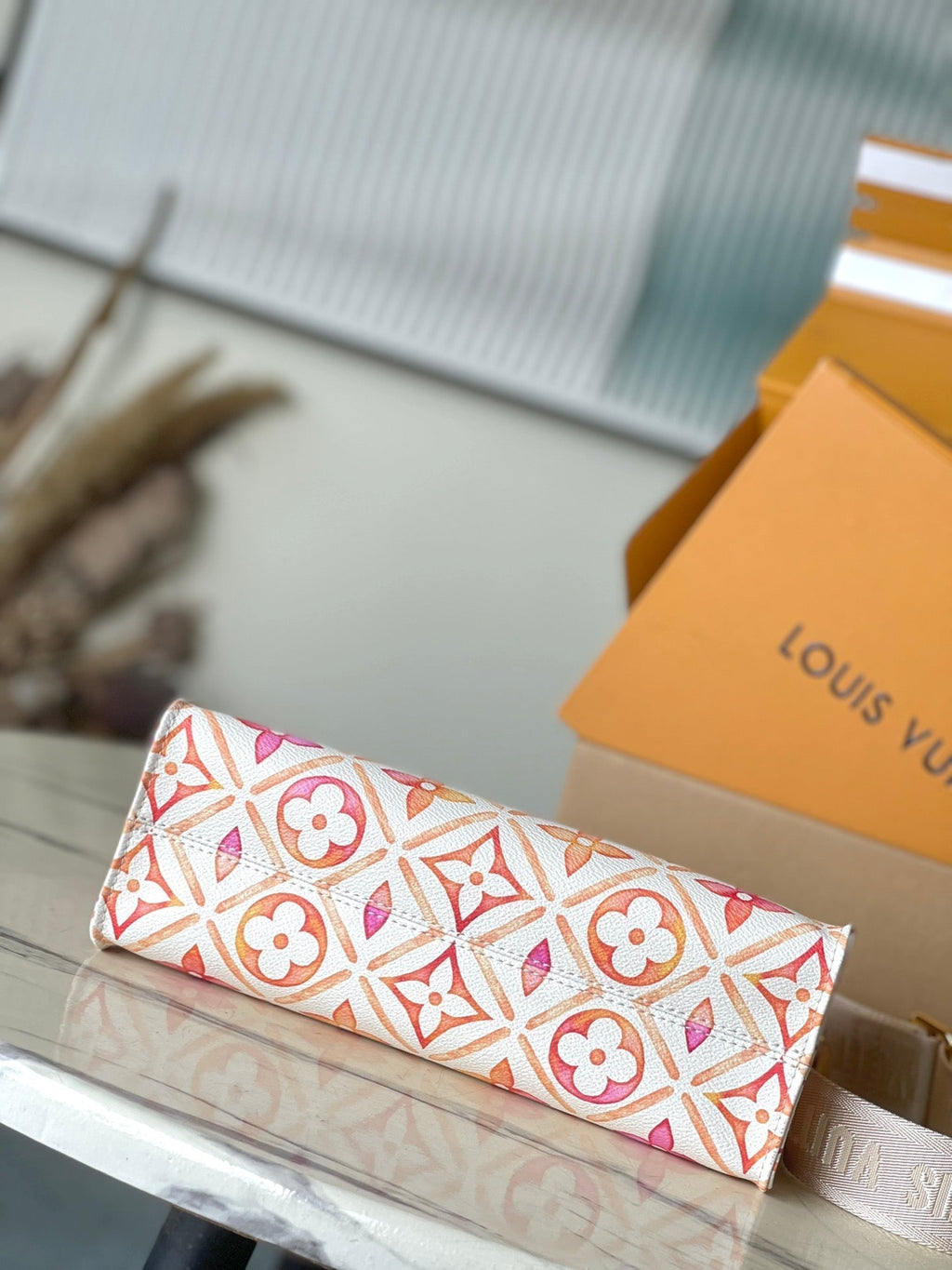LOUIS VUITTON ONTHEGO EAST WEST 25 IN CORAL MONOGRAM TILES CANVAS