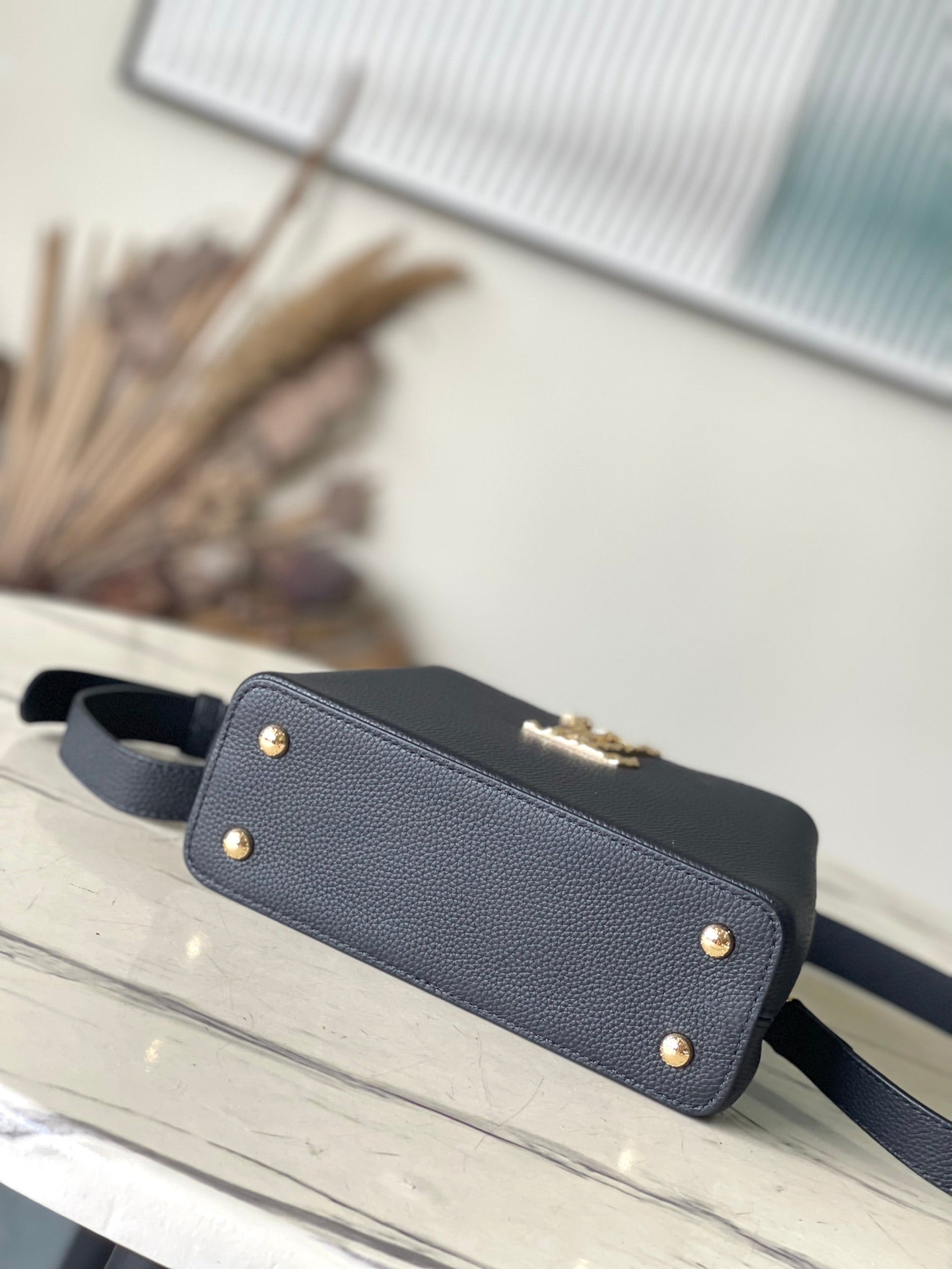 LOUIS VUITTON CAPUCINES EAST-WEST MINI 22 IN BLACK CALFSKIN GOLD HARDWARE