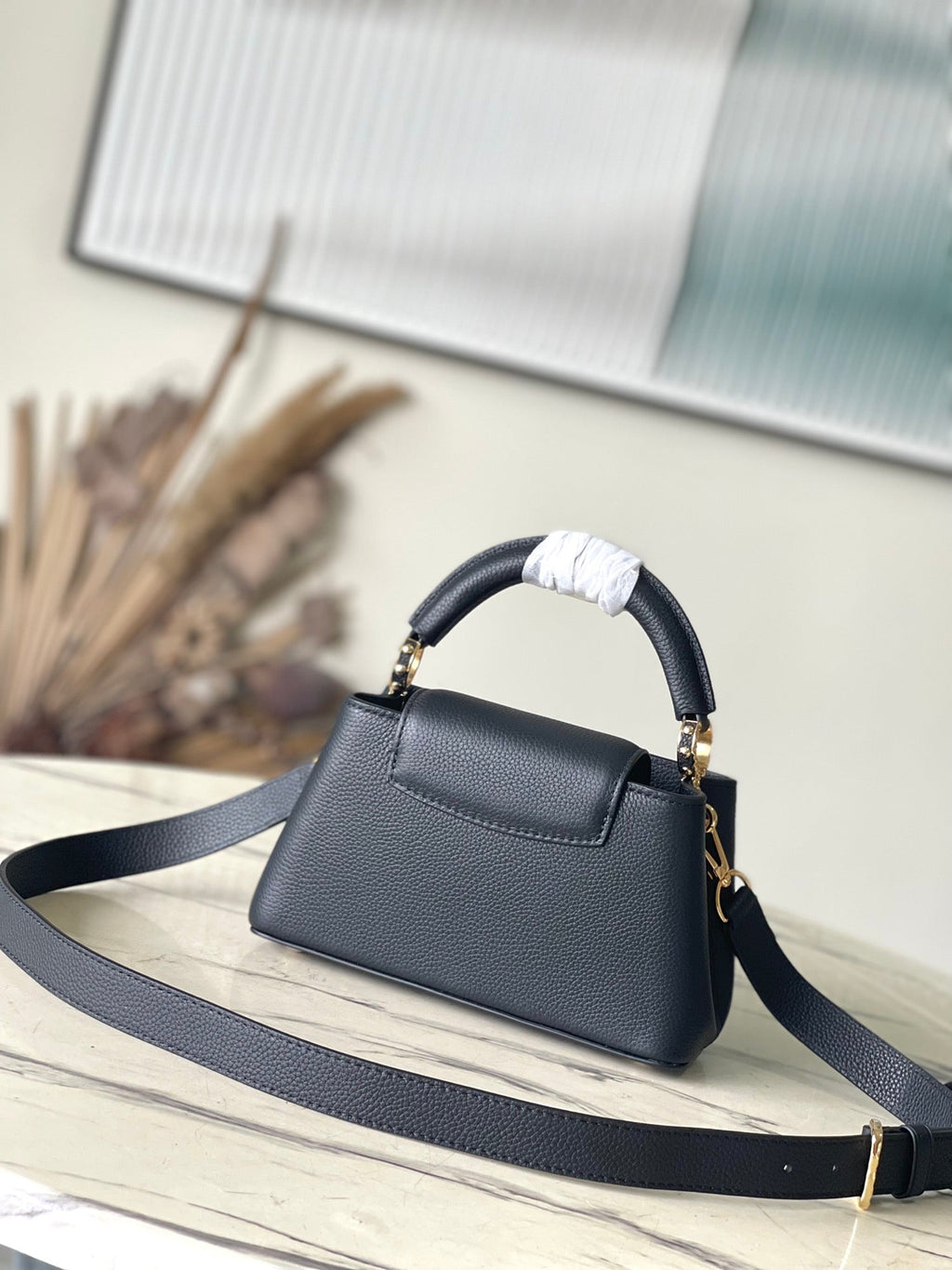 LOUIS VUITTON CAPUCINES EAST-WEST MINI 22 IN BLACK CALFSKIN GOLD HARDWARE