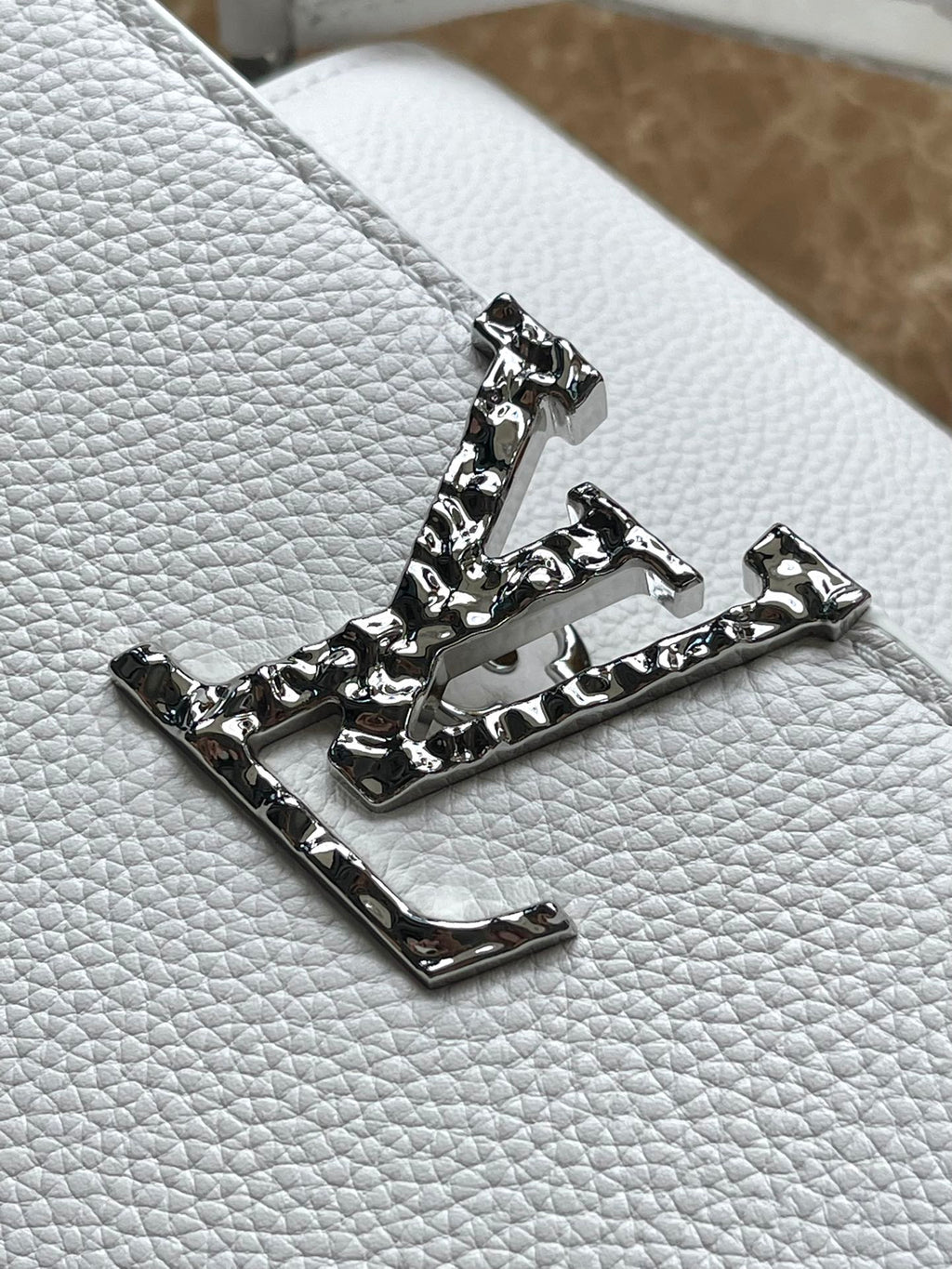 LOUIS VUITTON CAPUCINES EAST-WEST 33 IN WHITE CALFSKIN SILVER HARDWARE