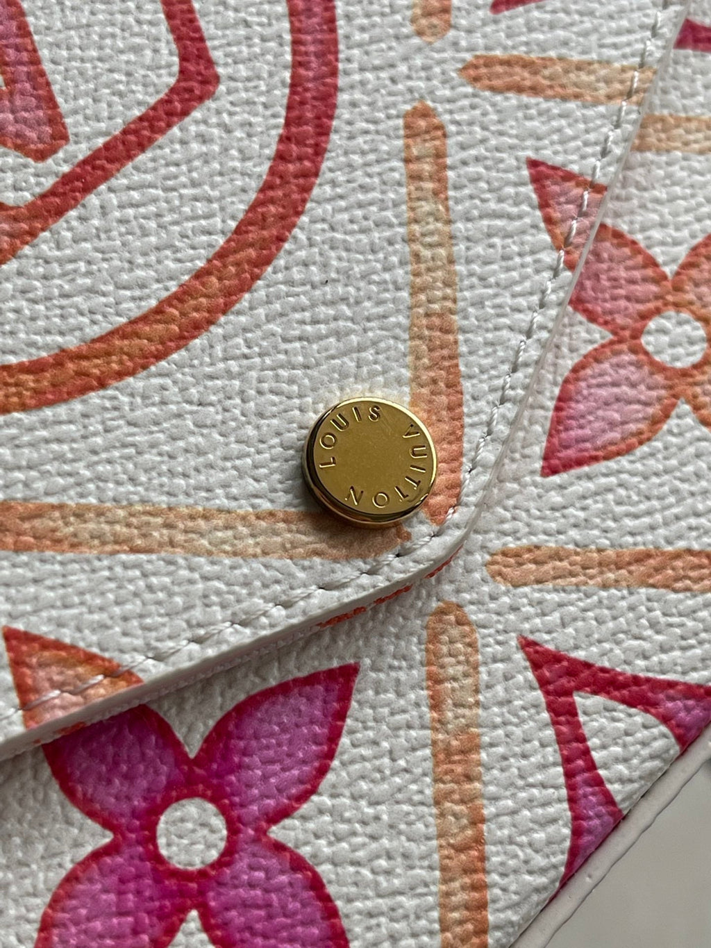 LOUIS VUITTON FÉLICIE POCHETTE 21 IN CORAL MONOGRAM TILES CANVAS