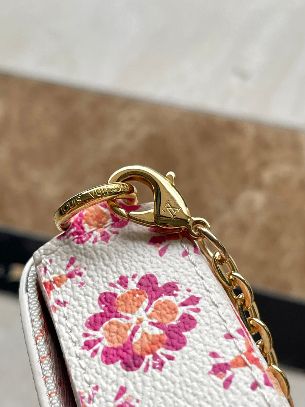 LOUIS VUITTON FÉLICIE POCHETTE 21 IN CORAL MONOGRAM TILES CANVAS