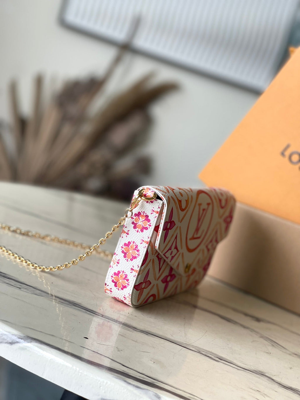 LOUIS VUITTON FÉLICIE POCHETTE 21 IN CORAL MONOGRAM TILES CANVAS
