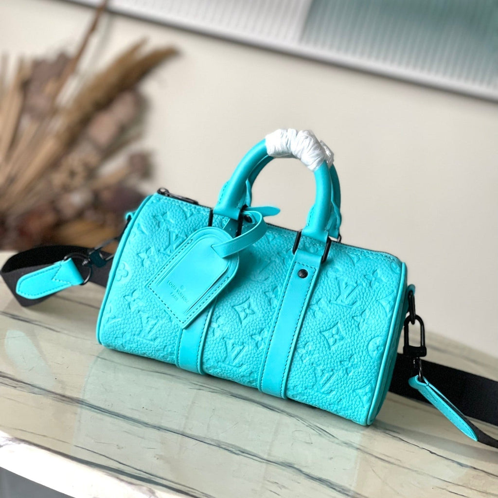 LOUIS VUITTON KEEPALL BANDOULIÈRE 25 IN TURQUOISE BLUE MONOGRAM EMBOSSED CALFSKIN