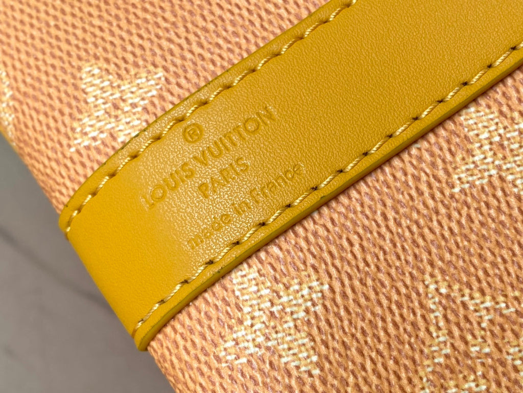 LOUIS VUITTON KEEPALL BANDOULIÈRE 55 IN ORANGE MONOGRAM HERITAGE CANVAS