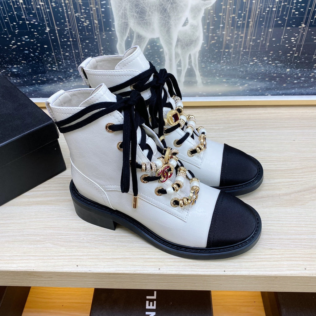 CHANEL COMBAT BOOTS IN WHITE WRINKLED CALFSKIN AND BLACK GROSGRAIN WITH FAUX PEARL