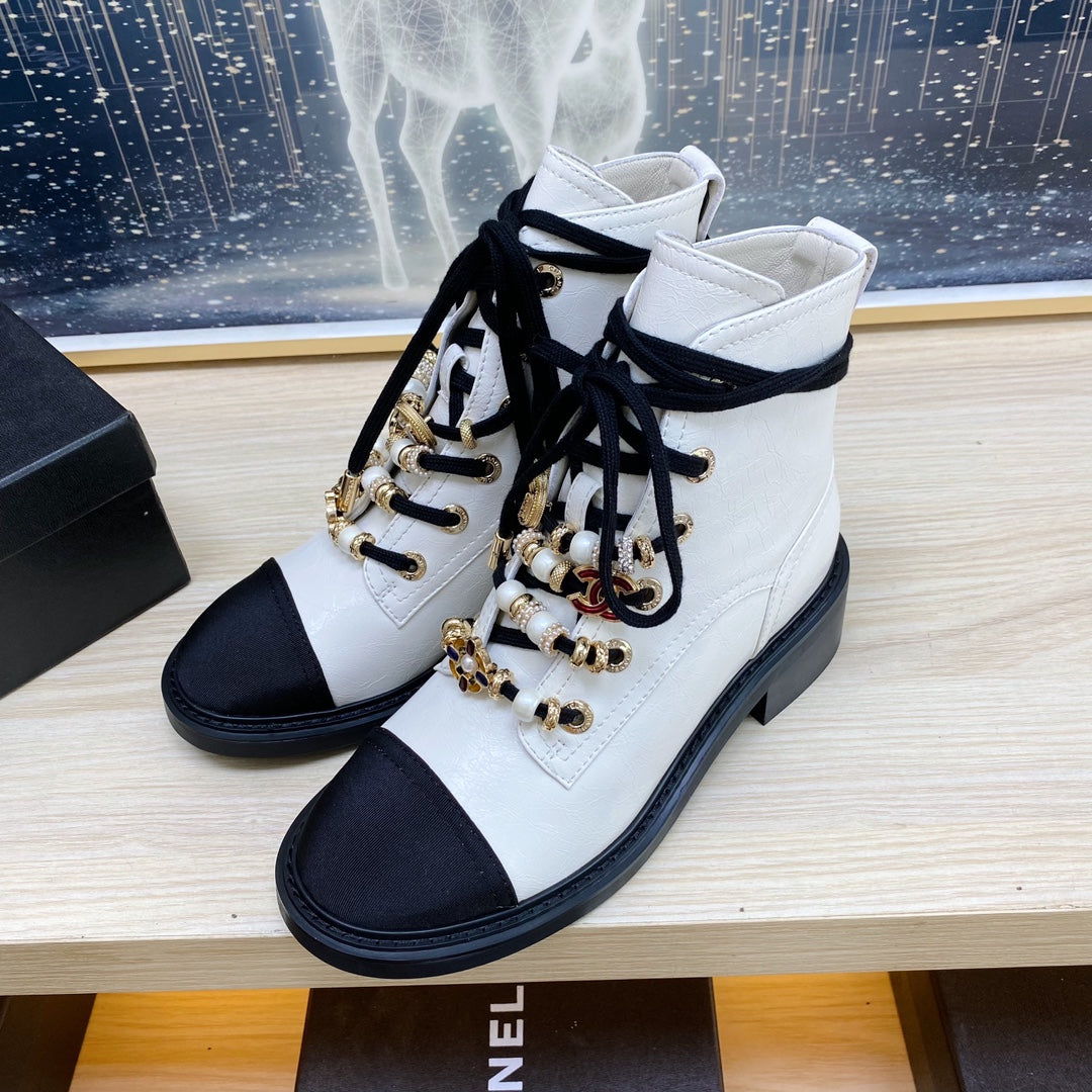 CHANEL COMBAT BOOTS IN WHITE WRINKLED CALFSKIN AND BLACK GROSGRAIN WITH FAUX PEARL