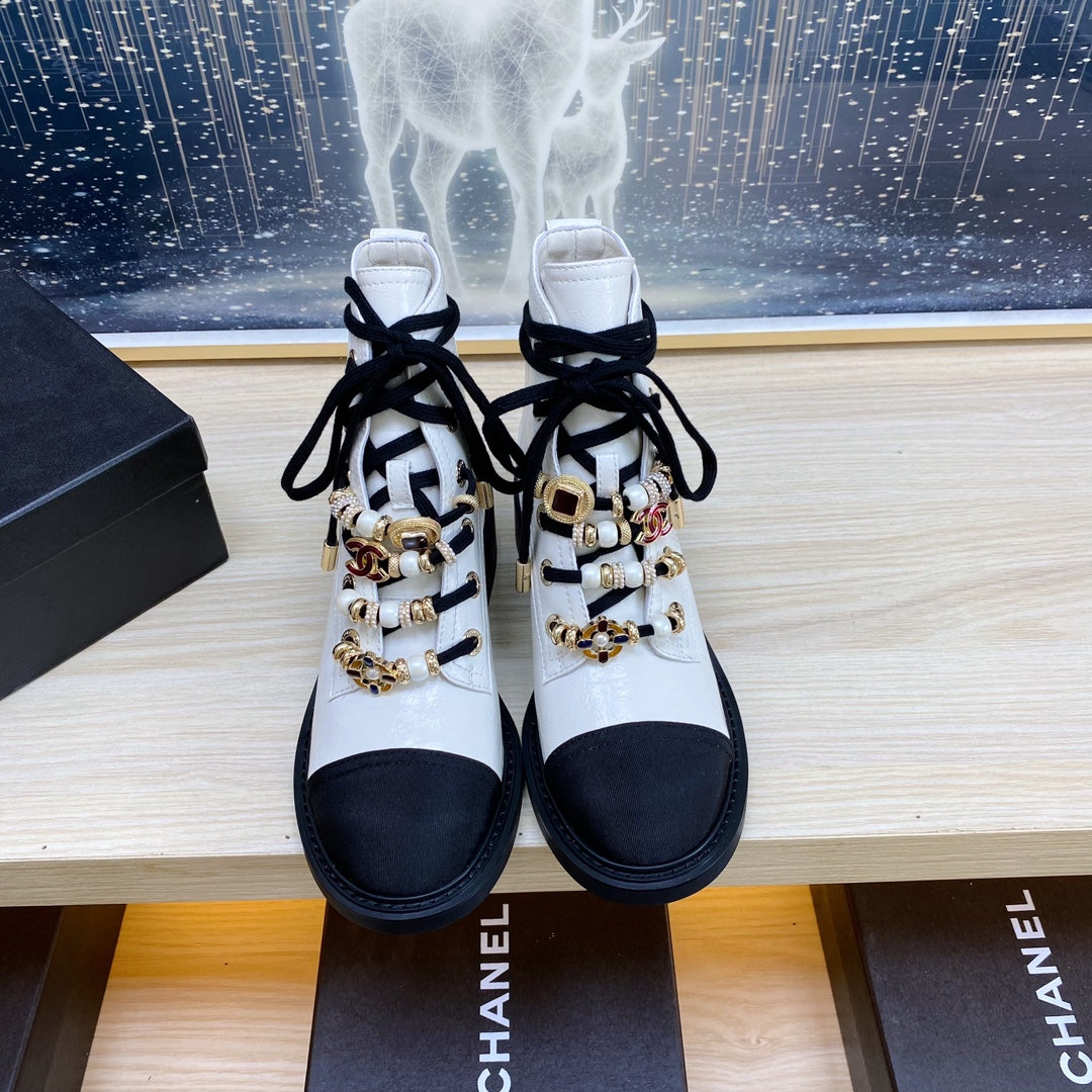 CHANEL COMBAT BOOTS IN WHITE WRINKLED CALFSKIN AND BLACK GROSGRAIN WITH FAUX PEARL