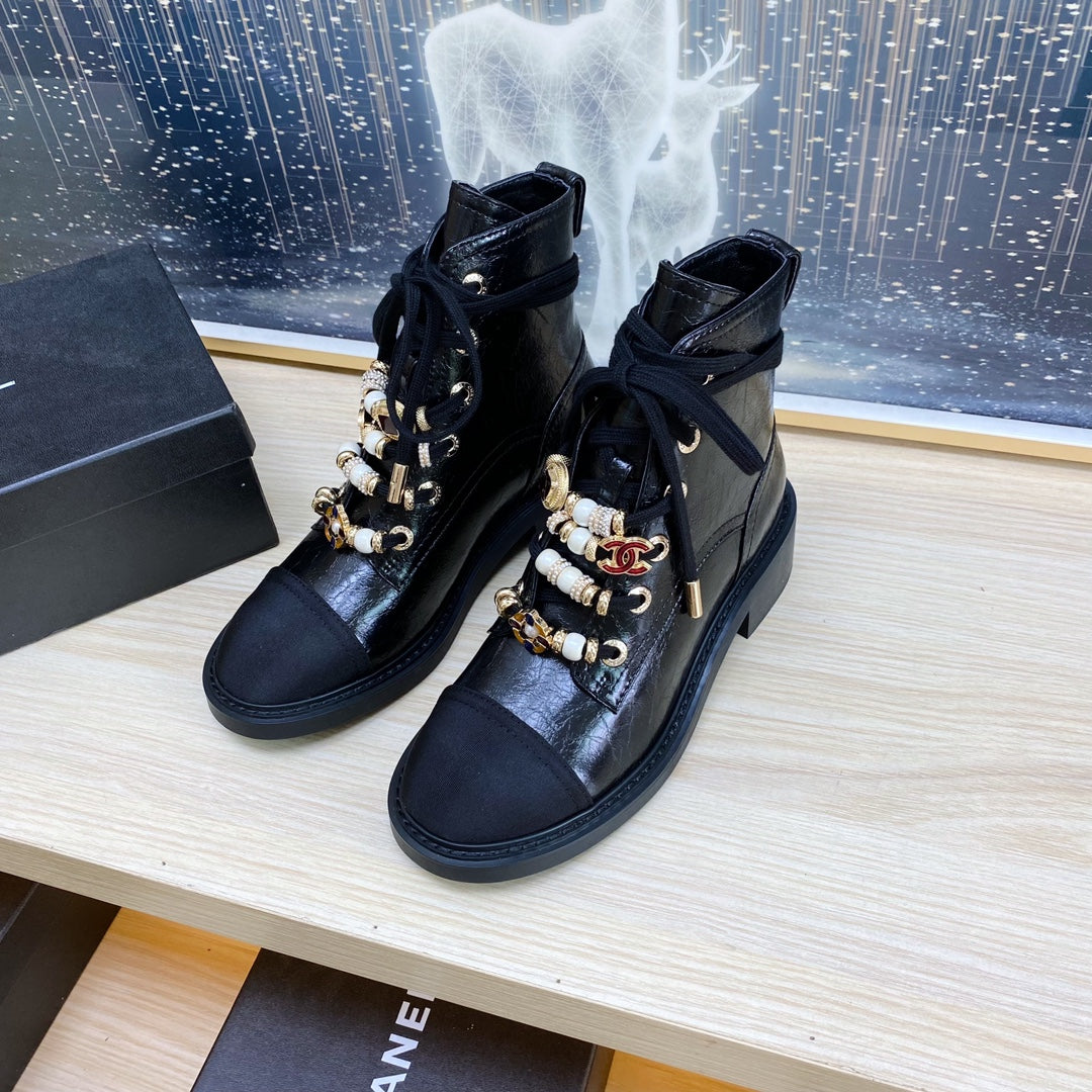 CHANEL COMBAT BOOTS IN BLACK WRINKLED CALFSKIN AND GROSGRAIN WITH FAUX PEARL