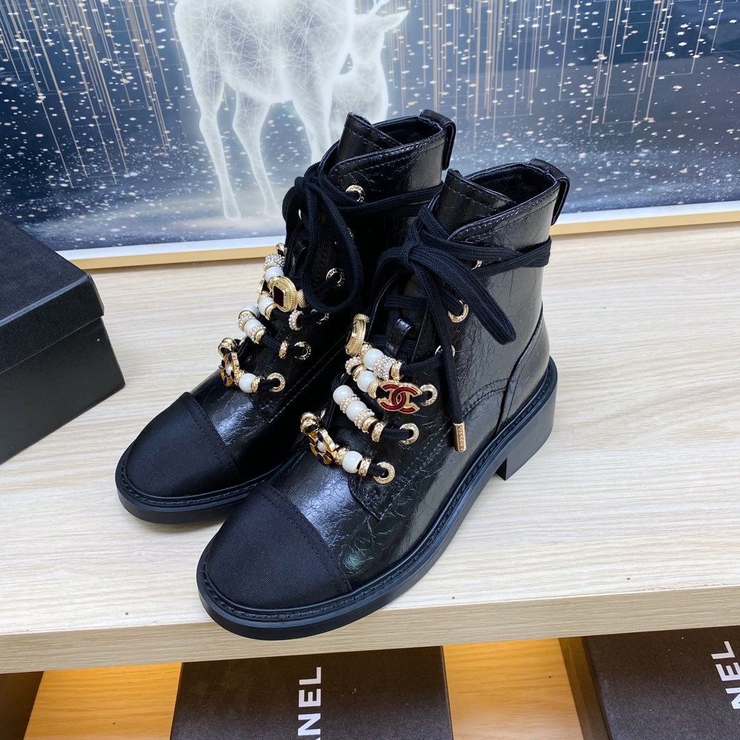 CHANEL COMBAT BOOTS IN BLACK WRINKLED CALFSKIN AND GROSGRAIN WITH FAUX PEARL