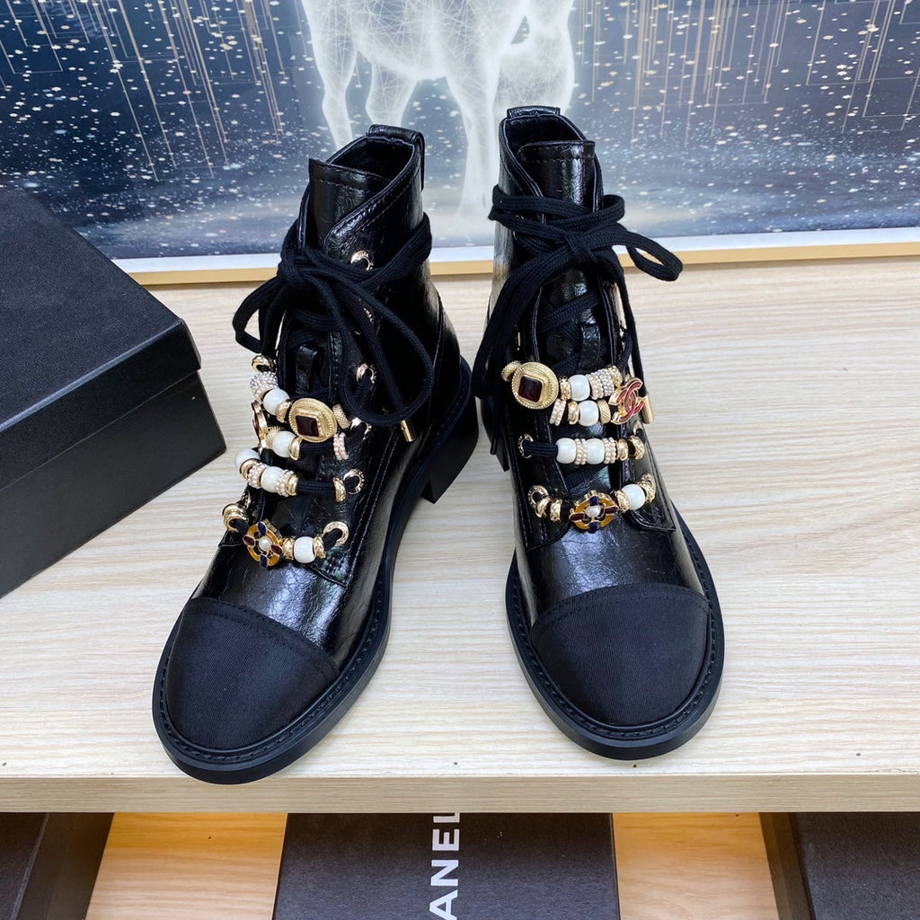 CHANEL COMBAT BOOTS IN BLACK WRINKLED CALFSKIN AND GROSGRAIN WITH FAUX PEARL