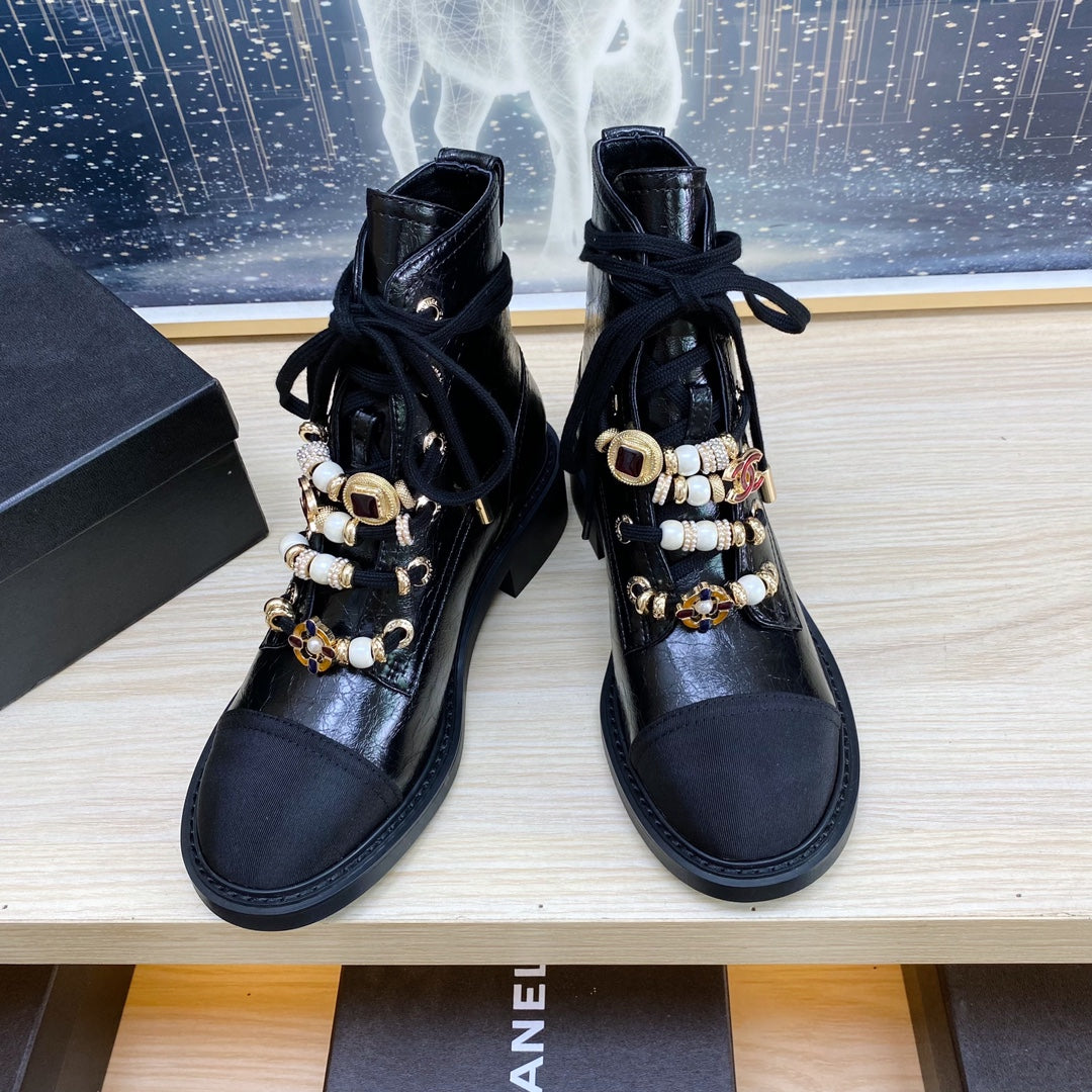 CHANEL COMBAT BOOTS IN BLACK WRINKLED CALFSKIN AND GROSGRAIN WITH FAUX PEARL