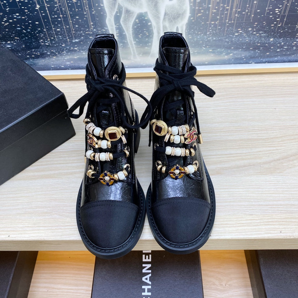 CHANEL COMBAT BOOTS IN BLACK WRINKLED CALFSKIN AND GROSGRAIN WITH FAUX PEARL