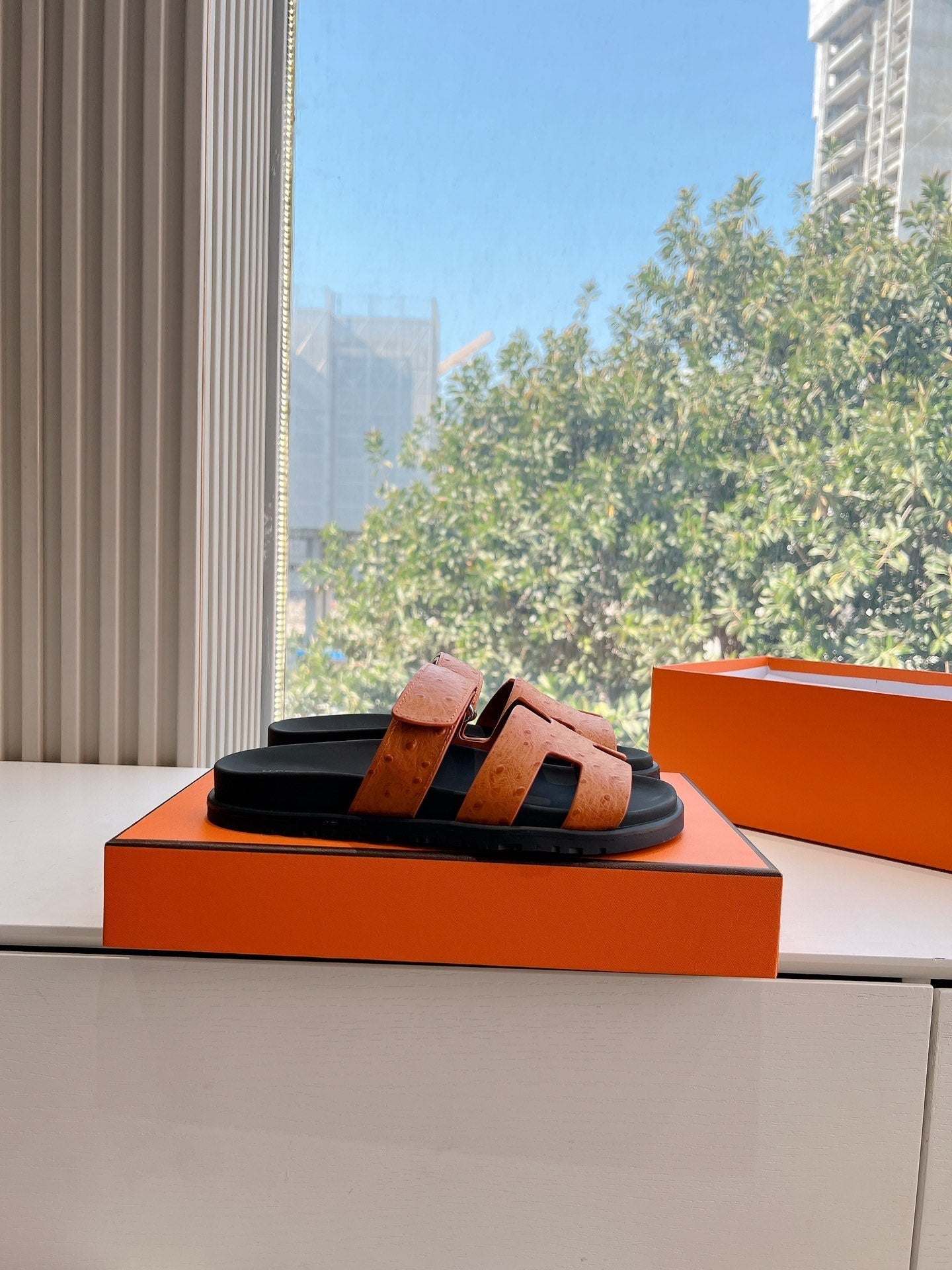 HERMES CHYPRE SANDAL IN VIVID ORANGE GRAINED CALFSKIN