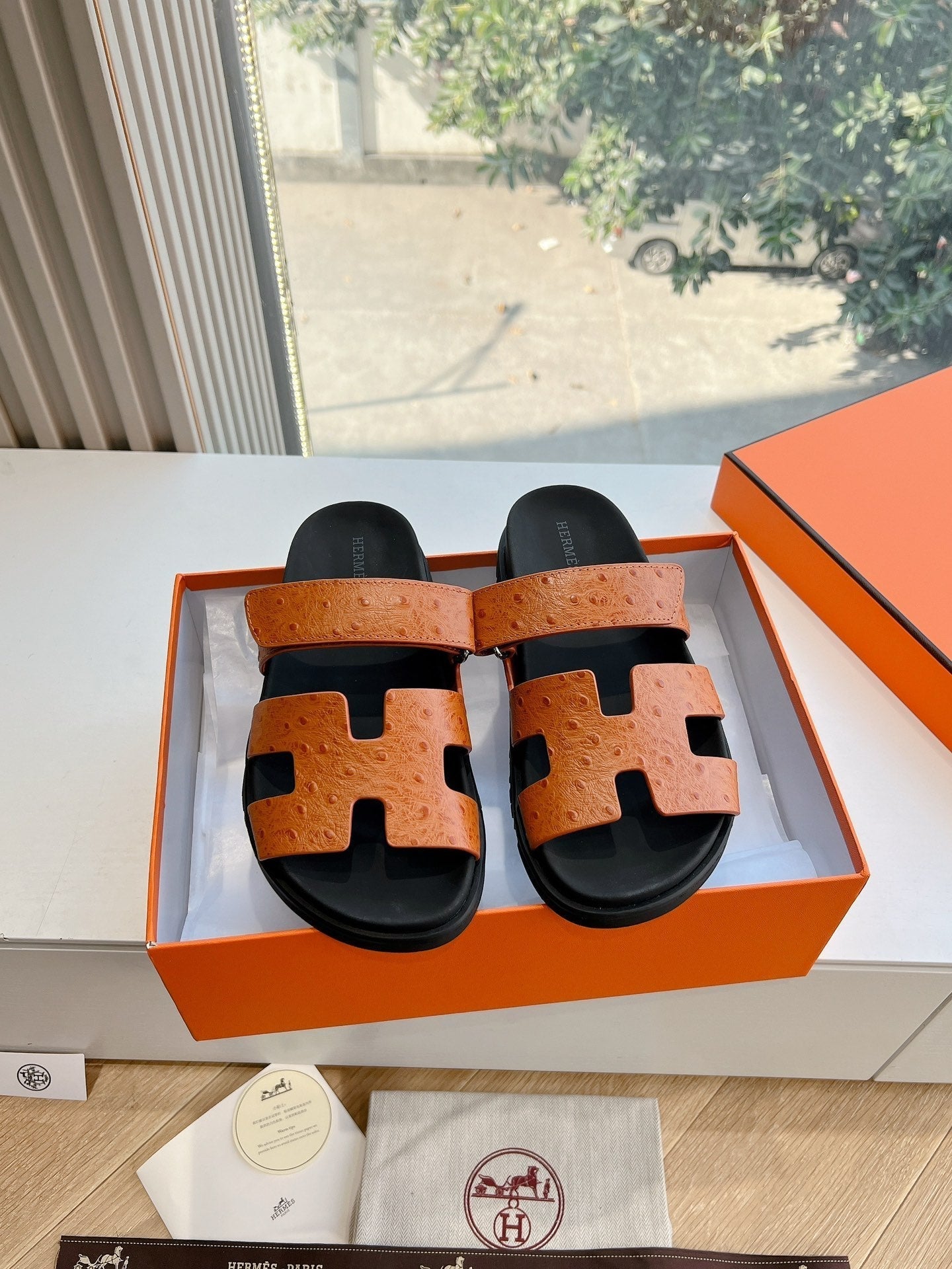 HERMES CHYPRE SANDAL IN VIVID ORANGE GRAINED CALFSKIN