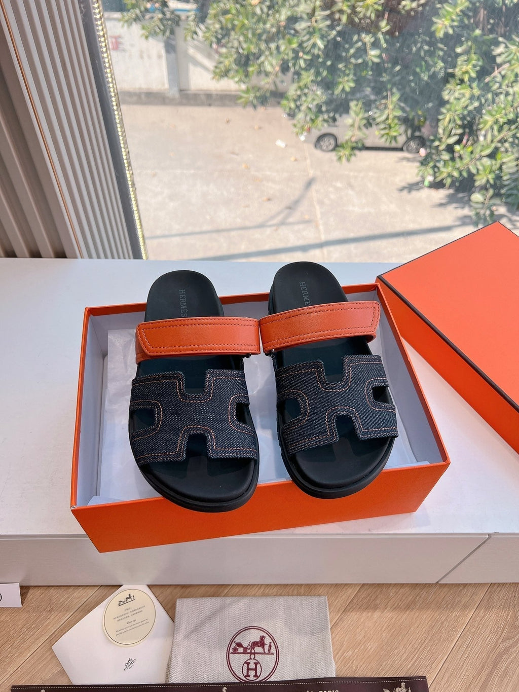 HERMES CHYPRE SANDAL IN BLACK DENIM AND VIVID ORANGE CALFSKIN