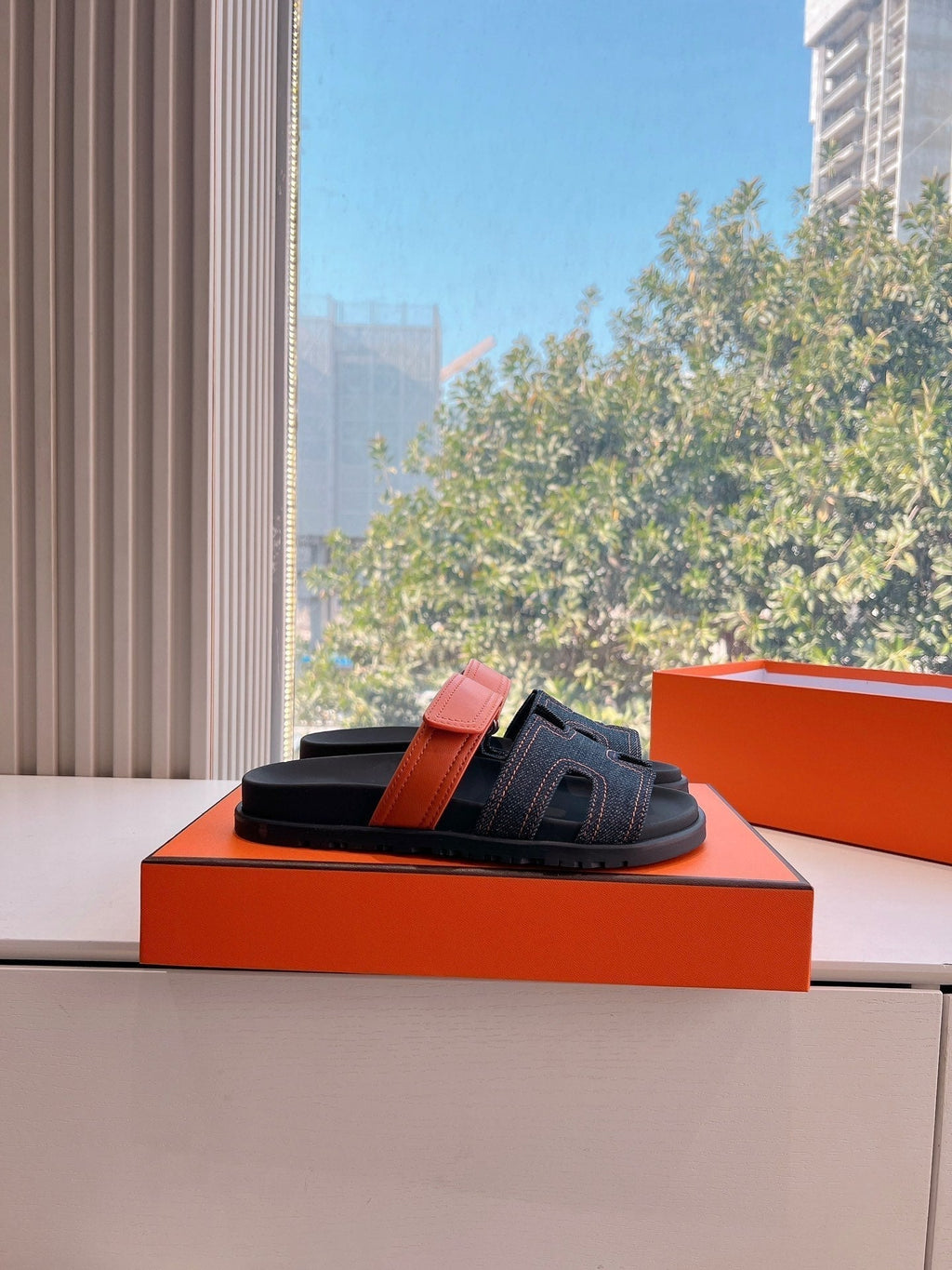 HERMES CHYPRE SANDAL IN BLACK DENIM AND VIVID ORANGE CALFSKIN