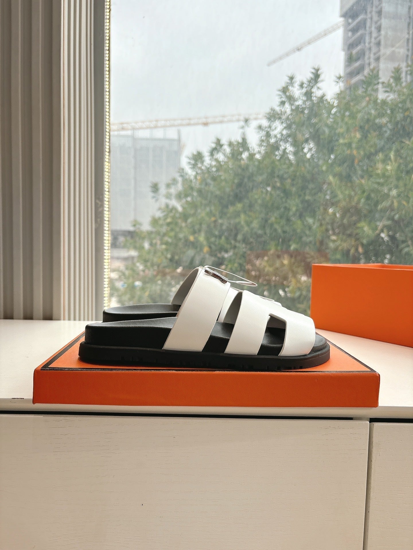 HERMES CHYPRE SANDAL IN WHITE CALFSKIN