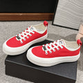CHANEL LACE-UP SNEAKERS IN CHERRY RED CANVAS