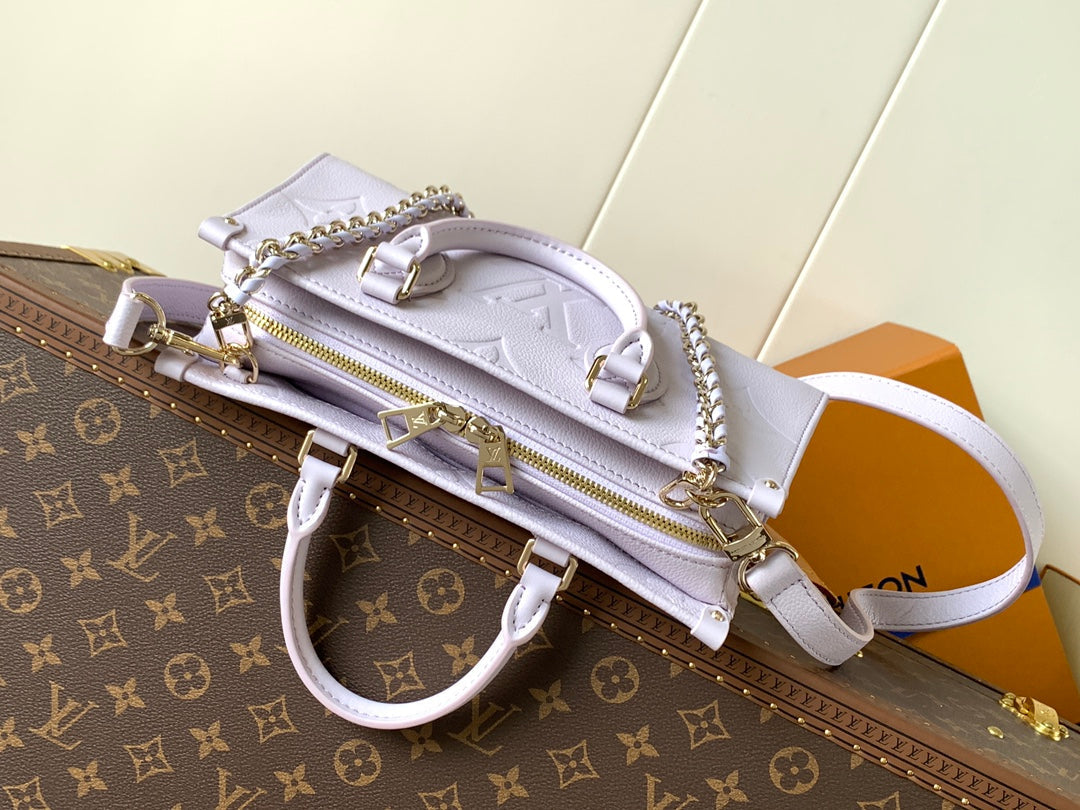 LOUIS VUITTON LV 25S ONTHEGO EAST WEST BAG 25 IN LIGHT LAVENDER CALFSKIN MONOGRAM EMPREINTE