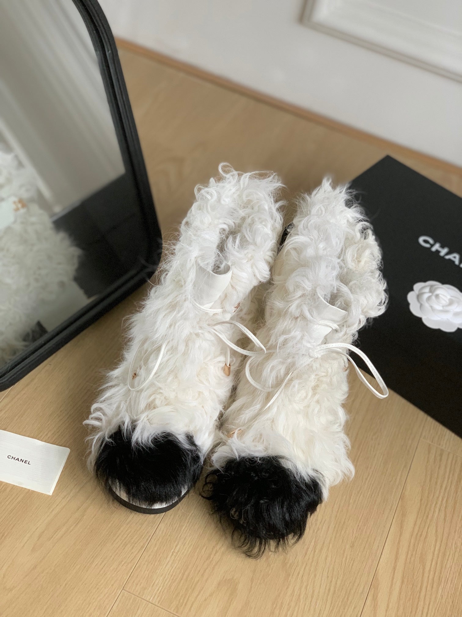 CHANEL ANKLE BOOTS IN WHITE MIX BLACK WOOL FUR