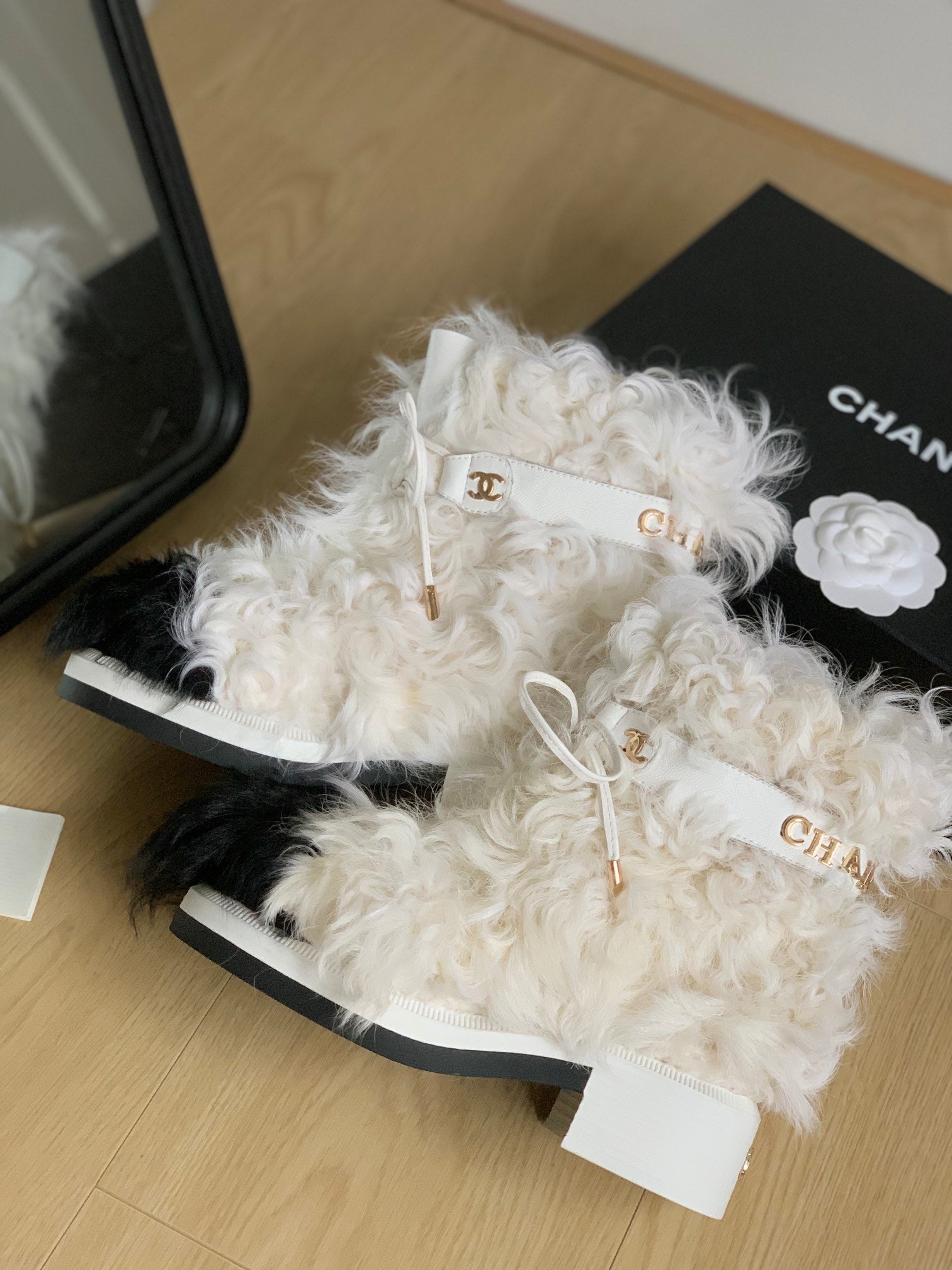 CHANEL ANKLE BOOTS IN WHITE MIX BLACK WOOL FUR