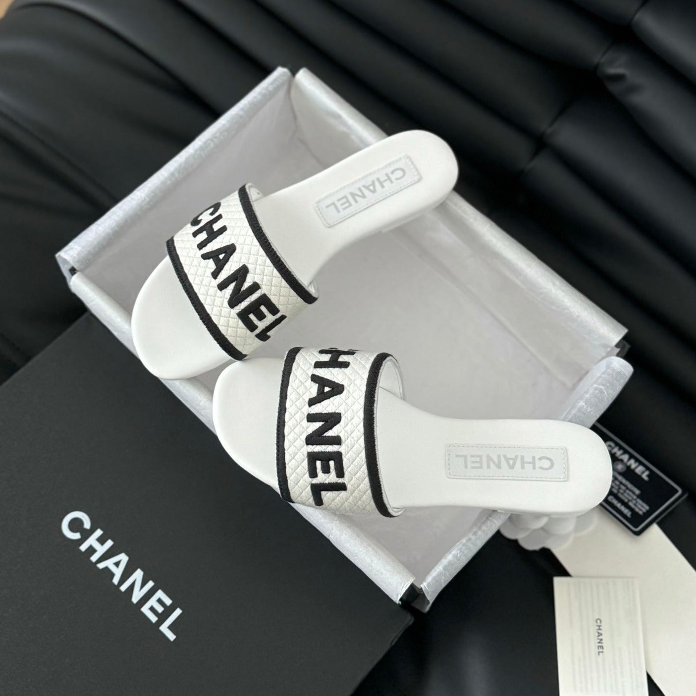 CHANEL Woven Embroidered Letter Slippers White Black