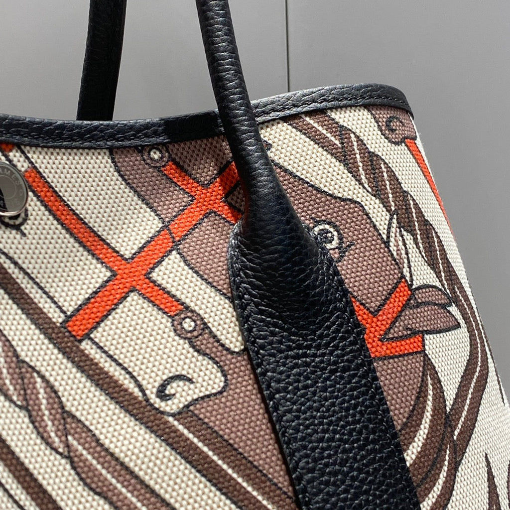 HERMES GARDEN PARTY 36 IN BEIGE ORANGE AND BROWN TOILE H CANVAS BLACK CALFSKIN HORSE TOTEM PRINT