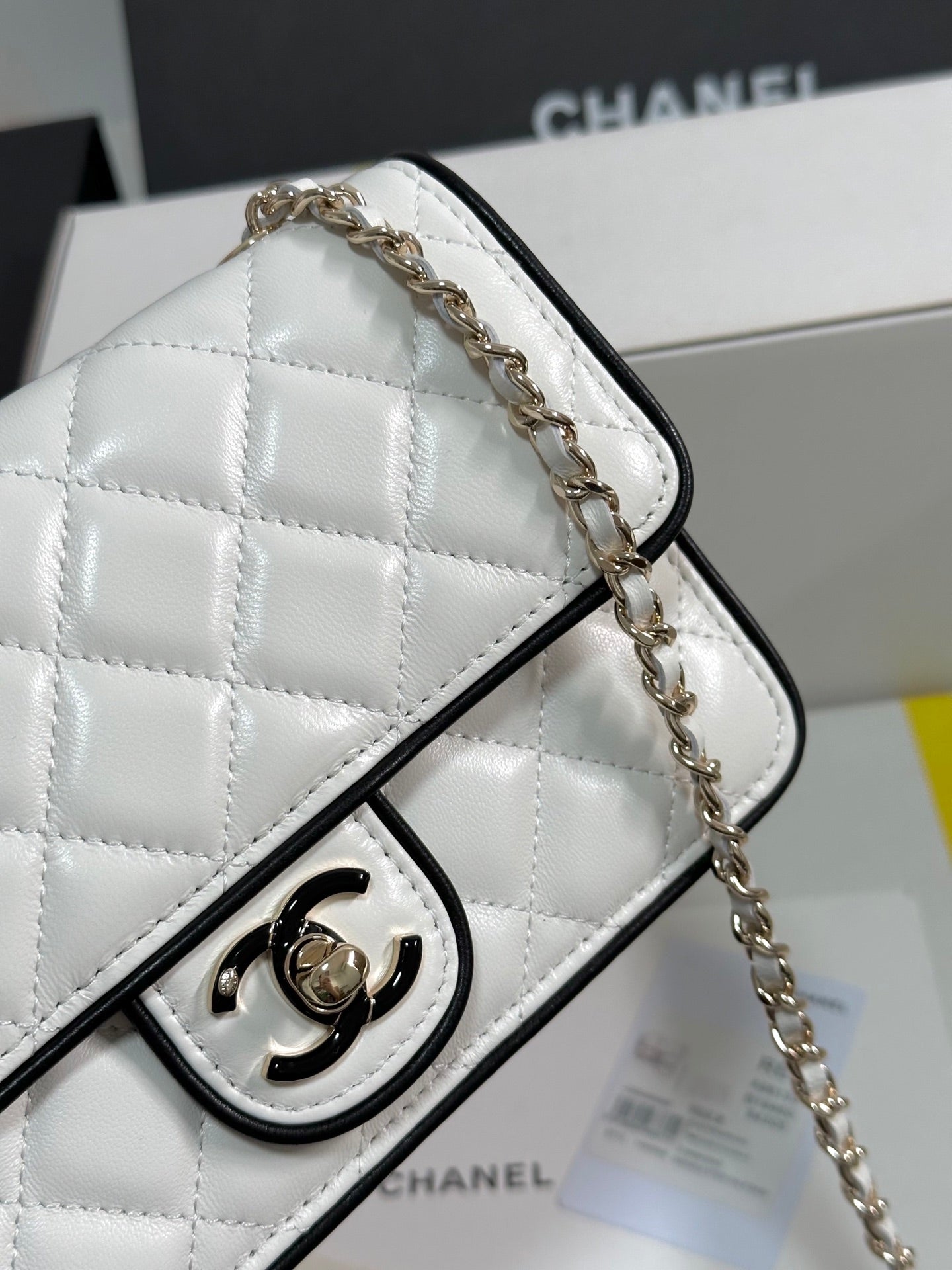 CHANEL QUILTED FLAP BAG WITH BLACK TRIM 19 IN WHITE LAMBSKIN