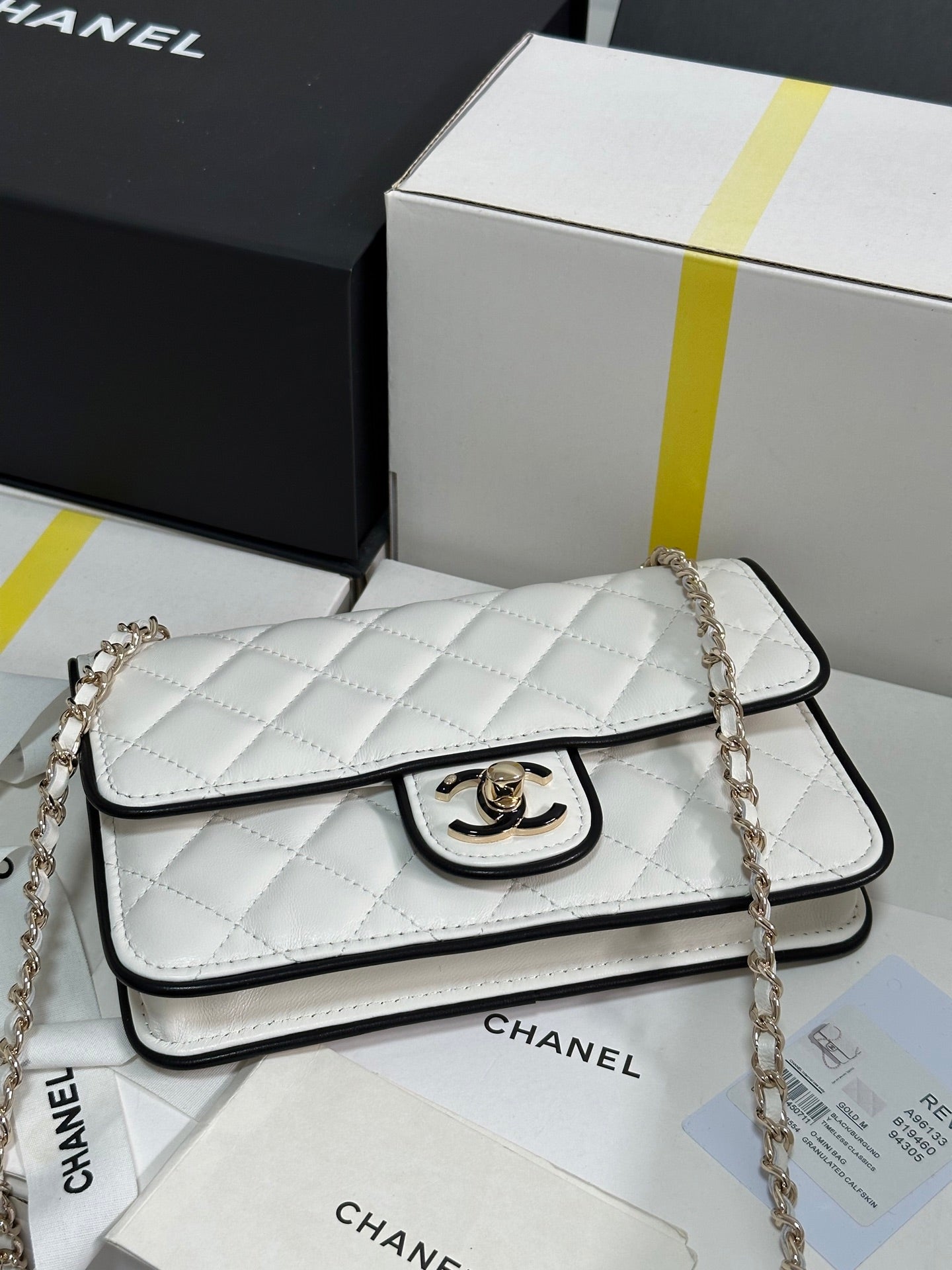 CHANEL QUILTED FLAP BAG WITH BLACK TRIM 19 IN WHITE LAMBSKIN