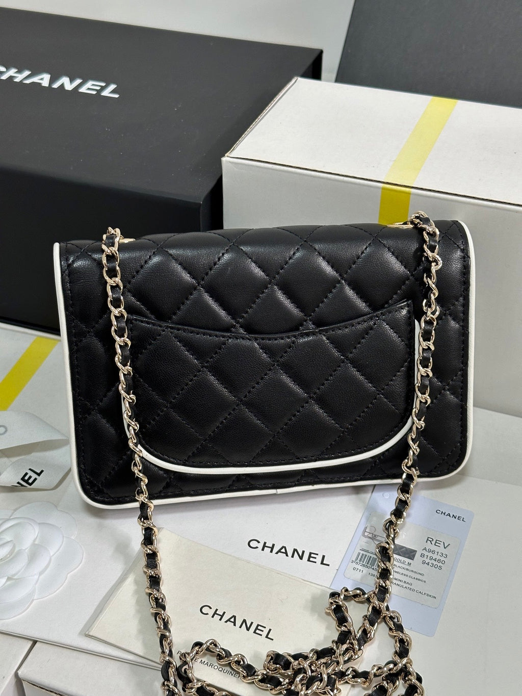 CHANEL QUILTED FLAP BAG WITH WHITE TRIM 19 IN BLACK LAMBSKIN