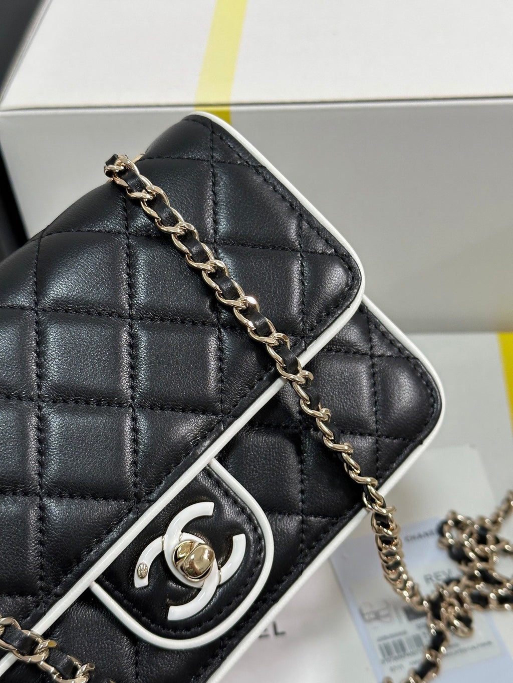 CHANEL QUILTED FLAP BAG WITH WHITE TRIM 19 IN BLACK LAMBSKIN