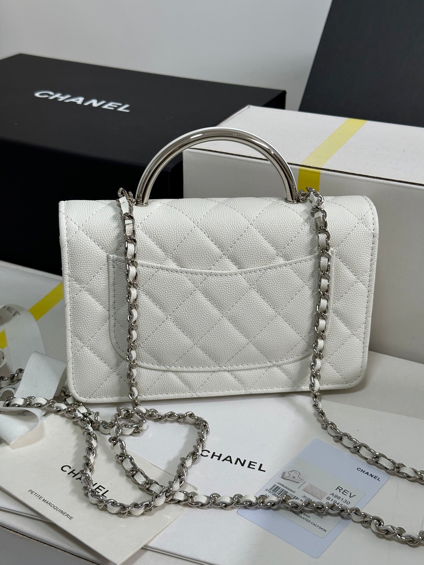 CHANEL FLAP BAG WITH SILVER-TONE HANDLE 19 IN WHITE CAVIAR SKIN
