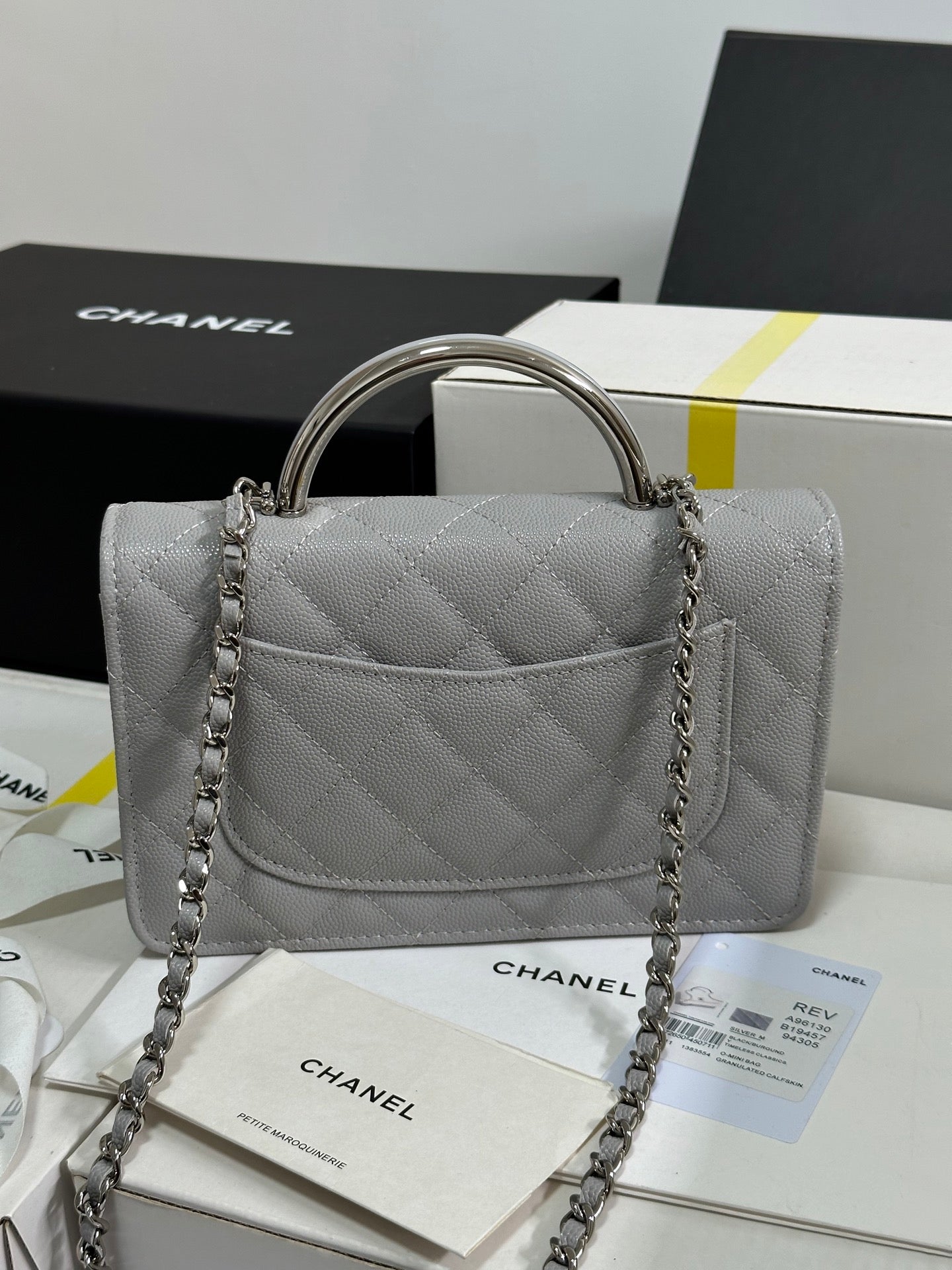 CHANEL FLAP BAG WITH SILVER-TONE HANDLE 19 IN GREY SHINY CAVIAR SKIN