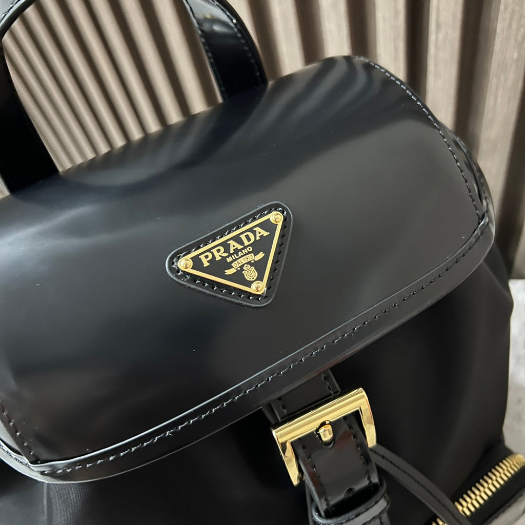 PRADA BACKPACK 25 IN BLACK RE-NYLON AND GLOSSY CALFSKIN GOLD HARDWARE