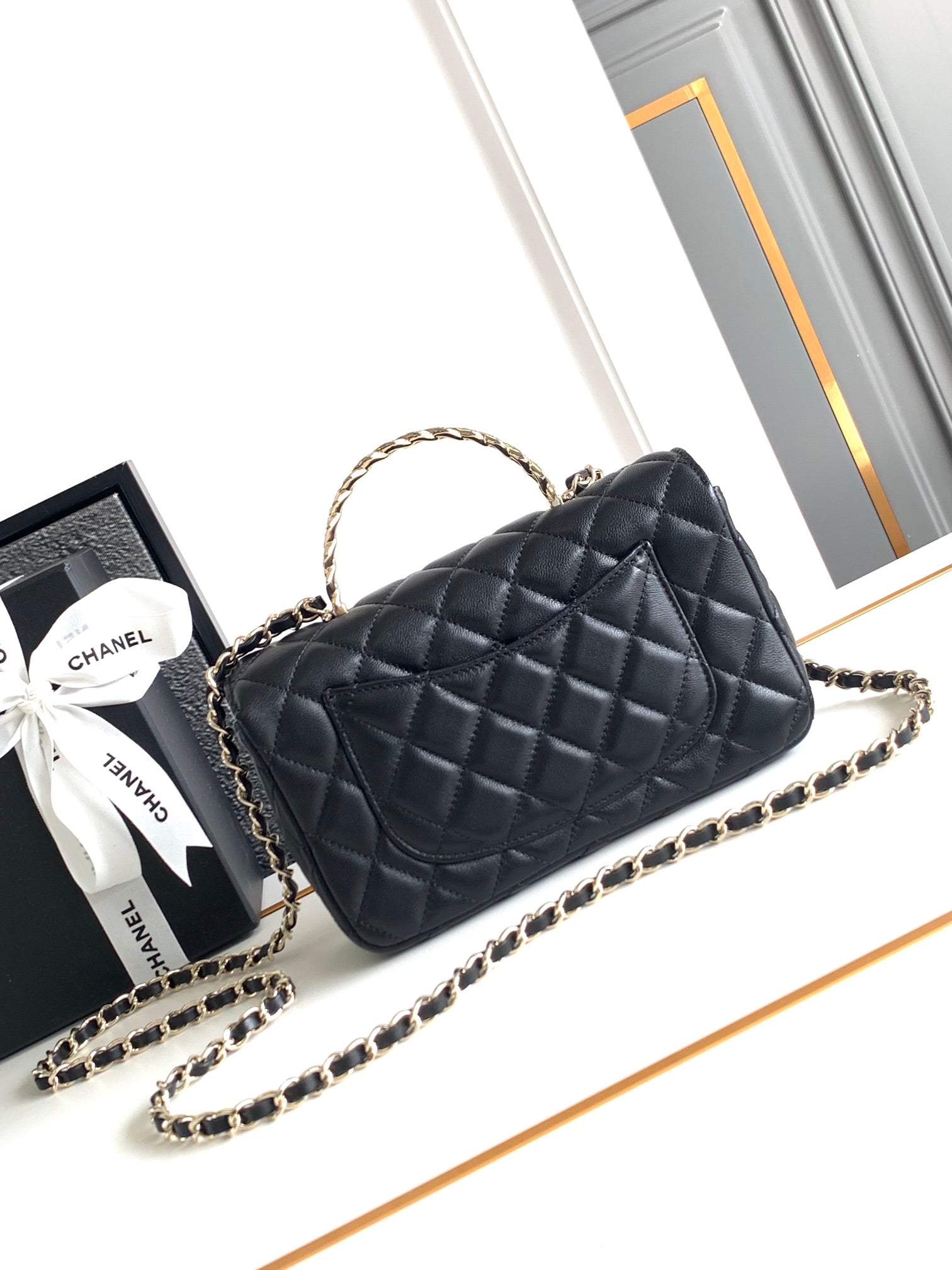CHANEL MINI 20 FLAP BAG IN BLACK CALFSKIN