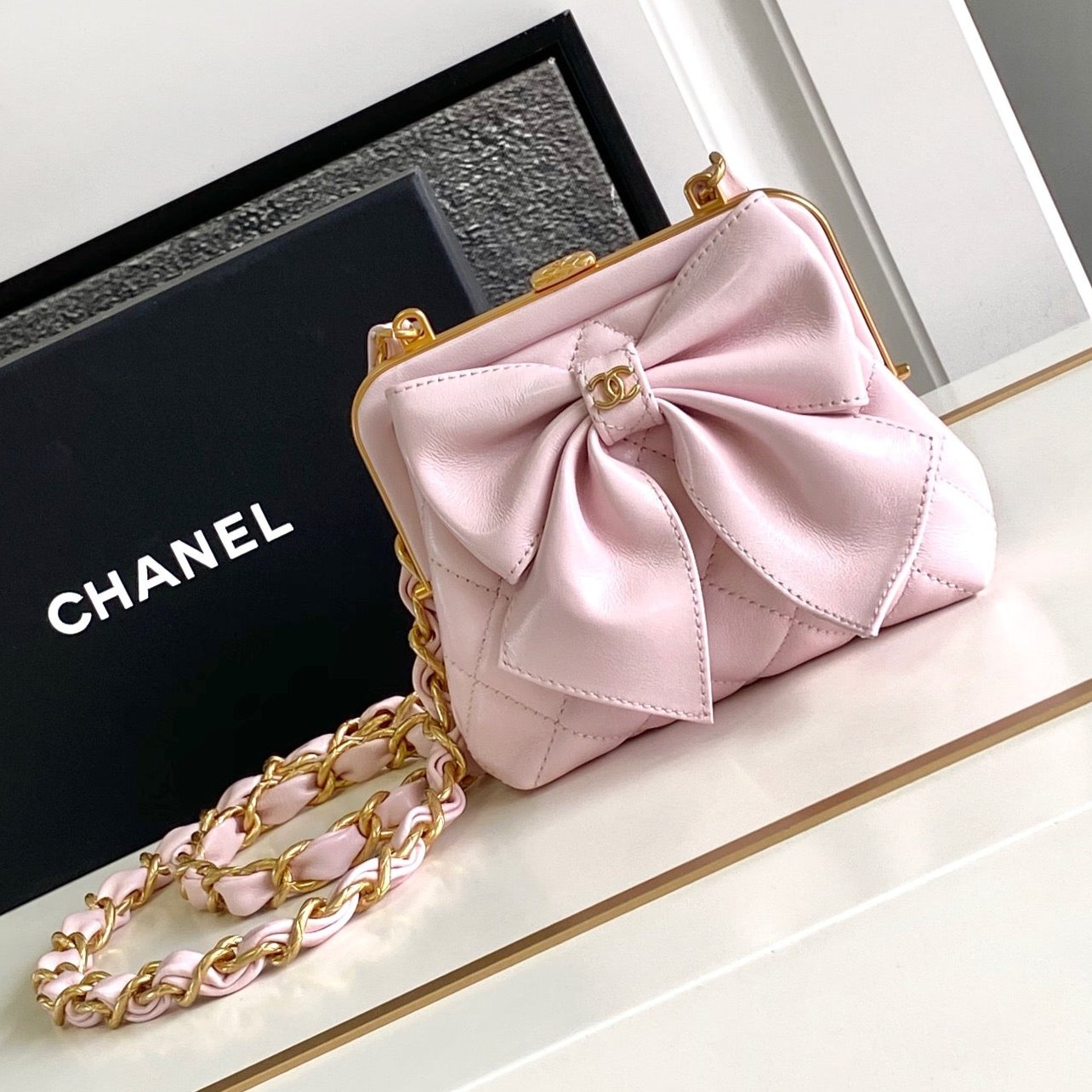 CHANEL MINI 13 CLUTCH WITH STRAP IN LIGHT PINK LAMBSKIN ATTACH BOW