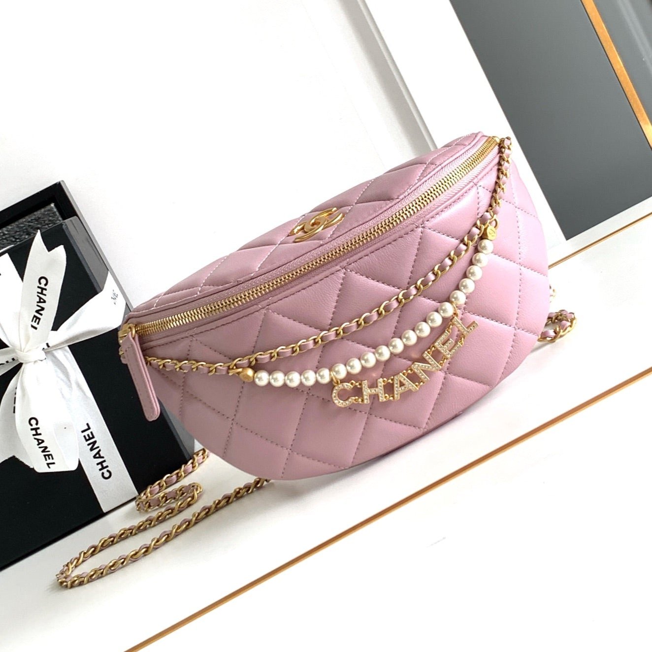 CHANEL WAIST 24 BAG IN LIGHT PINK CALFSKIN WITH PEARL CHAIN AND GOLD HARDWARE