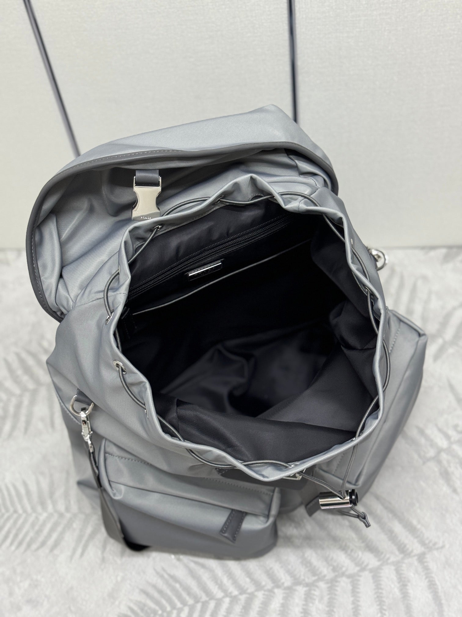 PRADA TRIANGLE LOGO BACKPACK 42 IN RHINO GRAY RE-NYLON