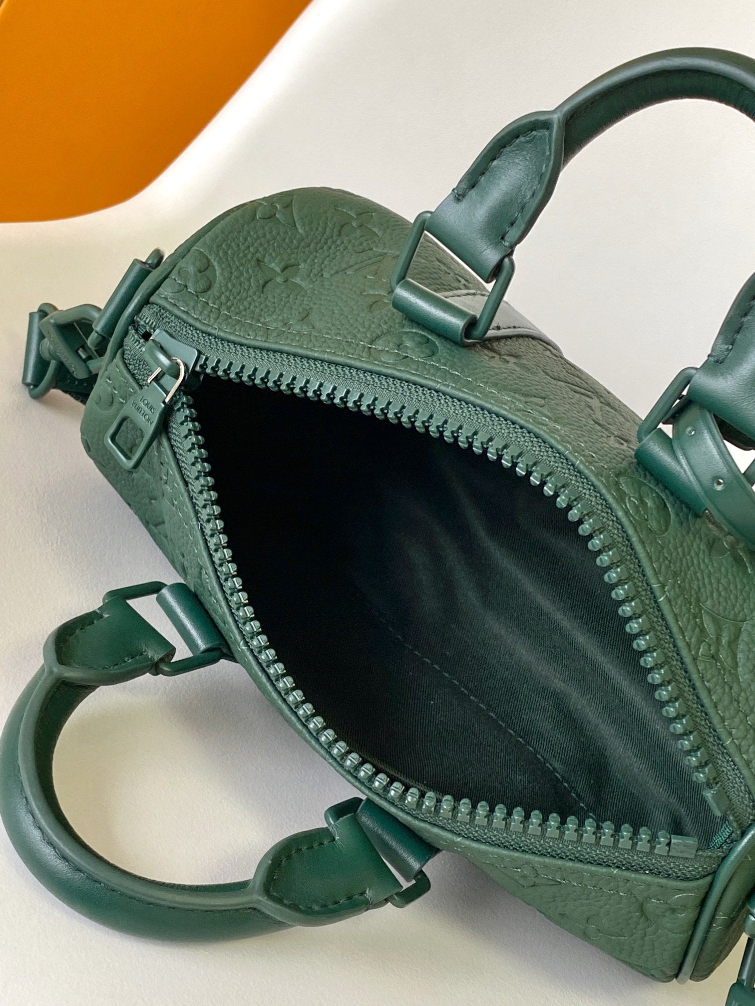 LOUIS VUITTON KEEPALL BANDOULIÈRE 25 IN FOREST GREEN MONOGRAM EMBOSSED CALFSKIN