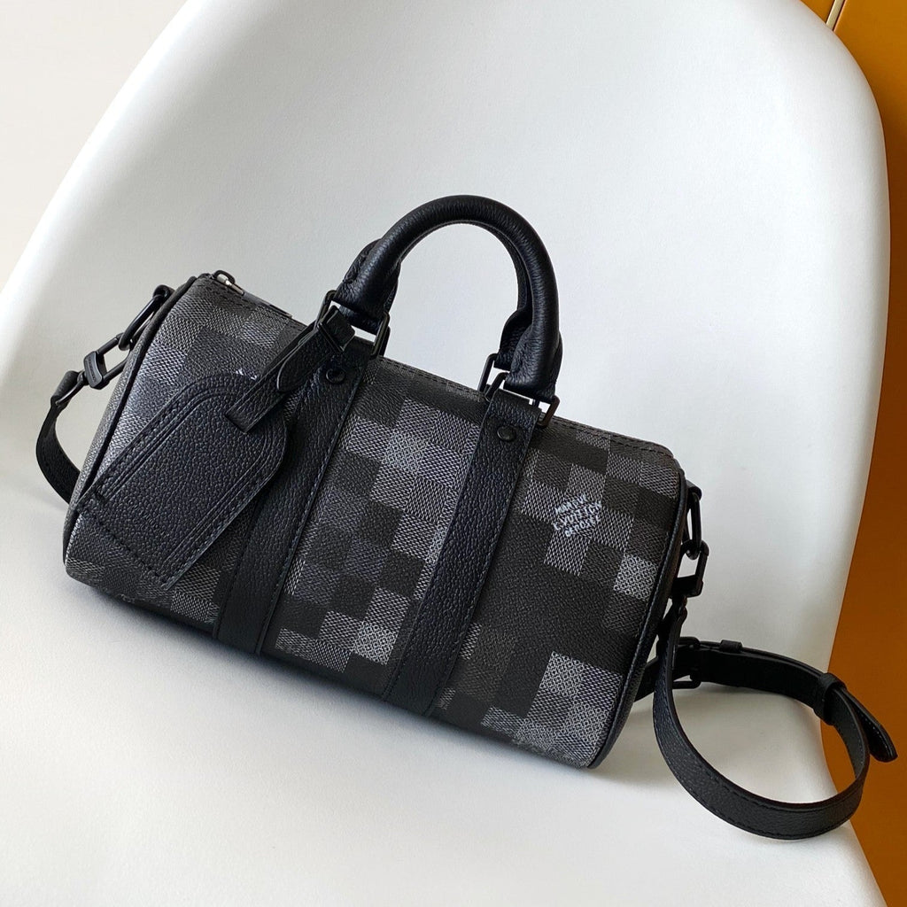 LOUIS VUITTON LV 25S KEEPALL BANDOULIÈRE 25 BAG IN DAMOFLAGE BLACK CALFSKIN