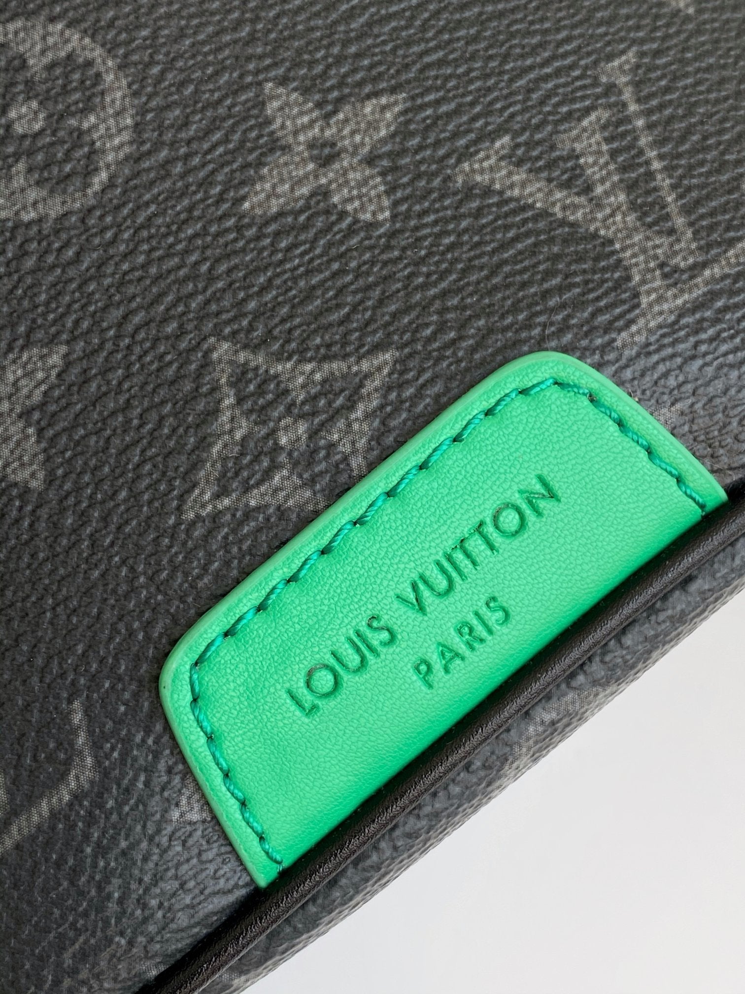LOUIS VUITTON LV 25S DISCOVERY BUMBAG 44 IN BLACK NEON JADE MONOGRAM ECLIPSE CANVAS AND CALFSKIN