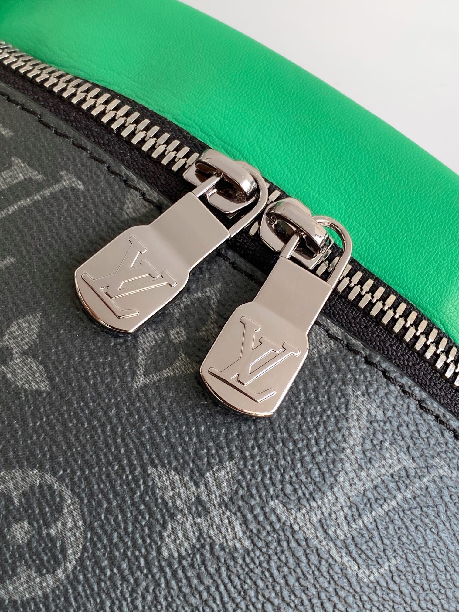 LOUIS VUITTON LV 25S DISCOVERY BUMBAG 44 IN BLACK NEON JADE MONOGRAM ECLIPSE CANVAS AND CALFSKIN