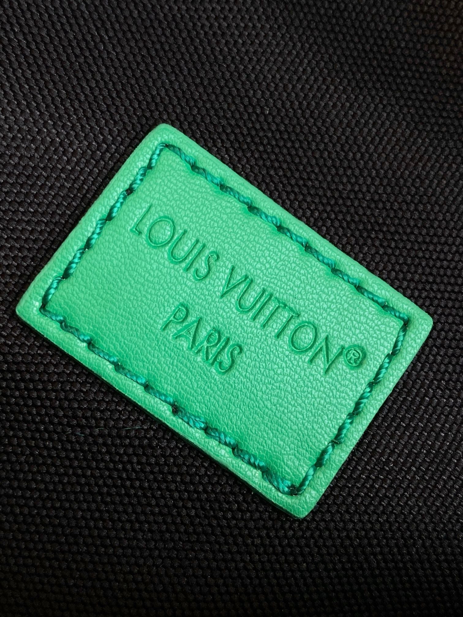 LOUIS VUITTON LV 25S DISCOVERY BUMBAG 44 IN BLACK NEON JADE MONOGRAM ECLIPSE CANVAS AND CALFSKIN