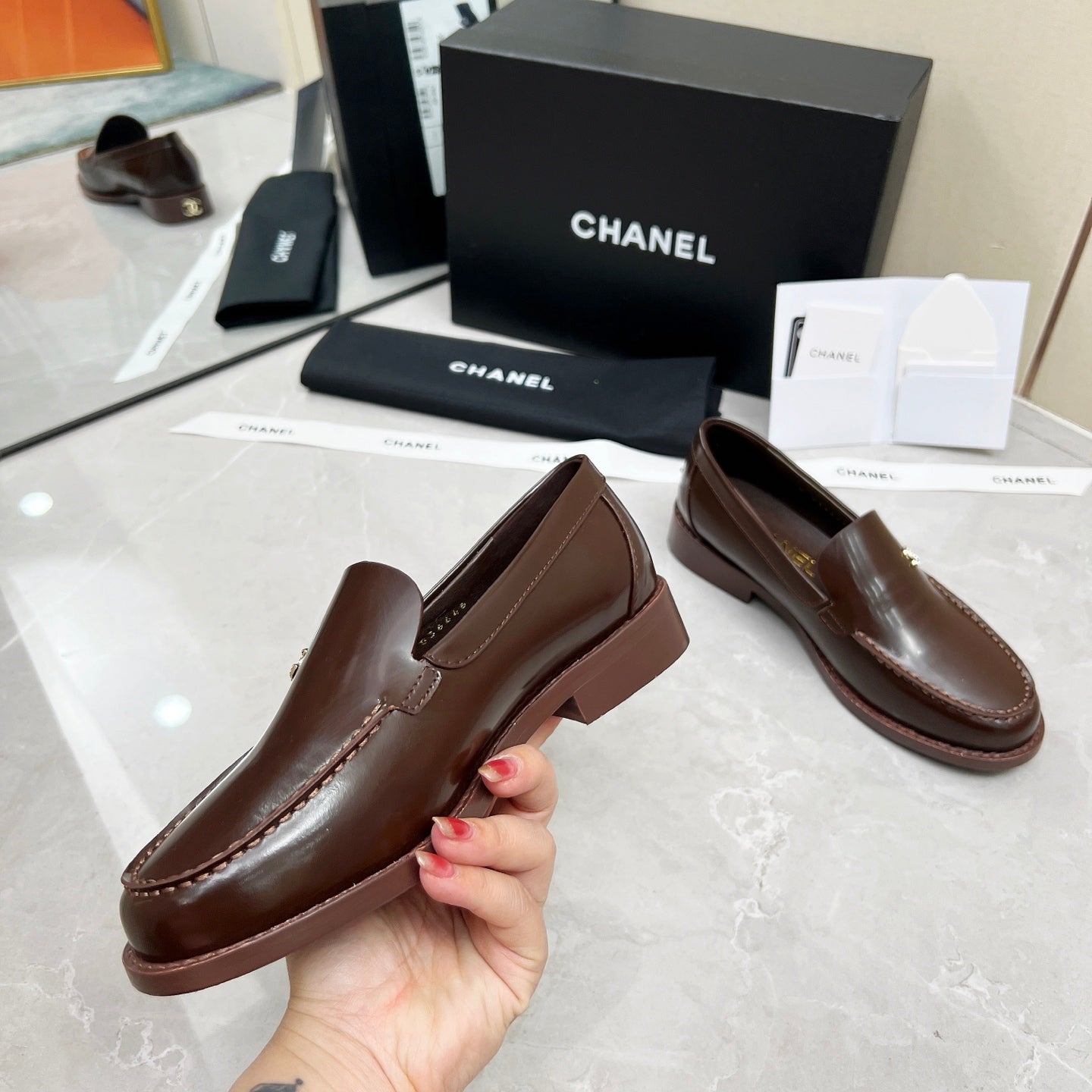 CHANEL MOASINS IN BROWN CALFSKIN