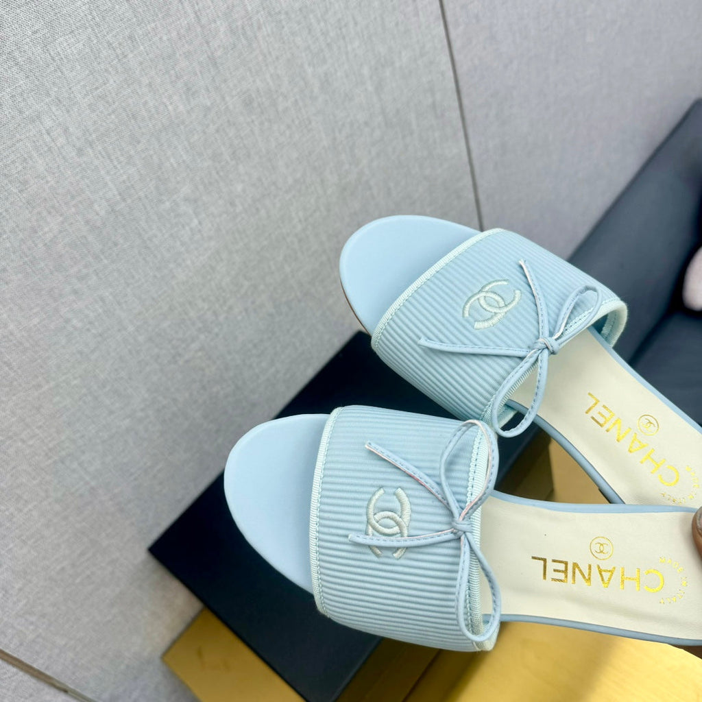 CHANEL BOW SLIPPERS IN LIGHT BLUE LAMBSKIN