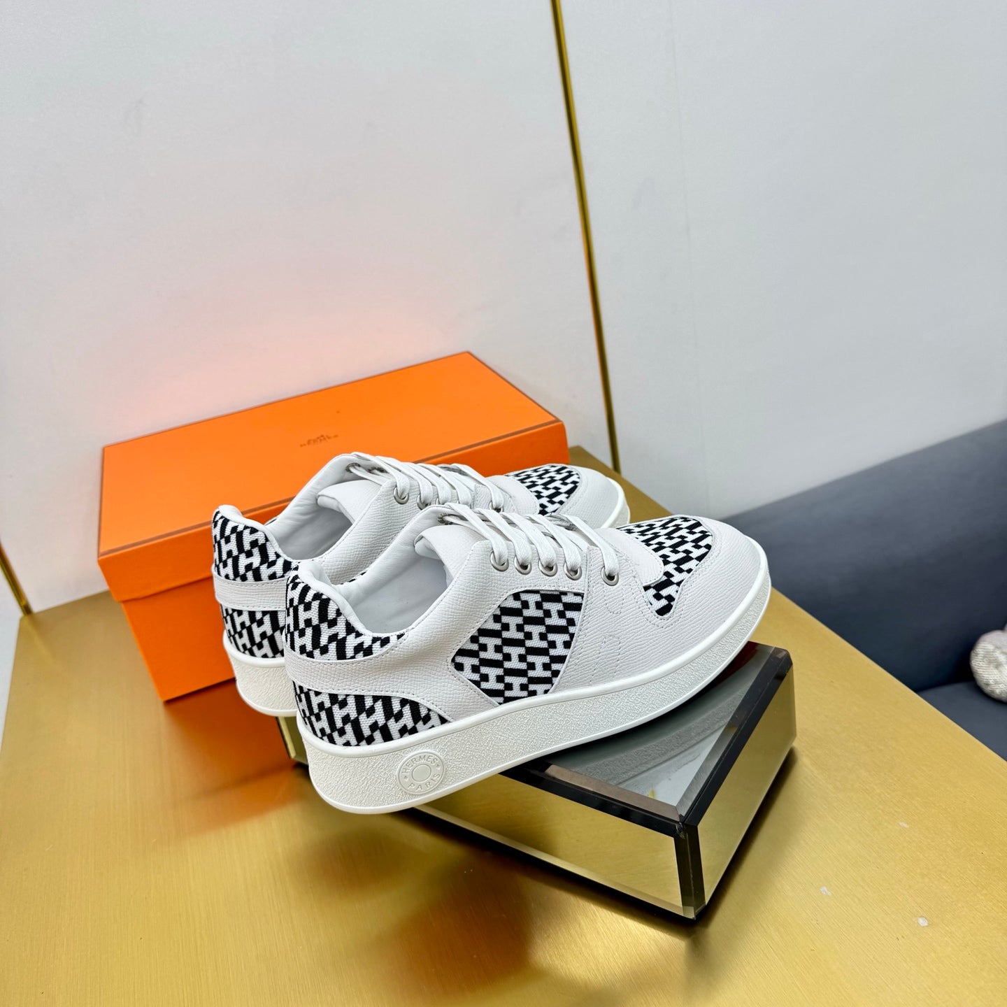 HERMES FREE SNEAKER IN WHITE CALFSKIN AND "H EN BIAIS" BLACK CANVAS