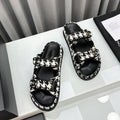 CHANEL dad sandals black white mules