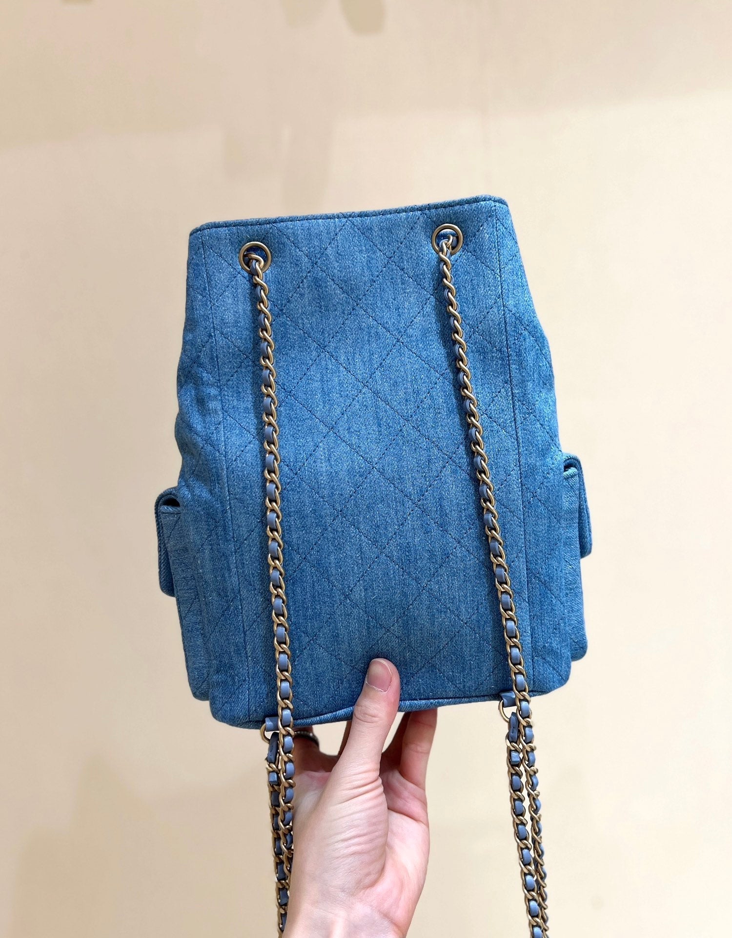 CHANEL DRAWSTRING BUCKET BACKPACK 24 IN MALIBU BLUE DENIM GOLD HARDWARE
