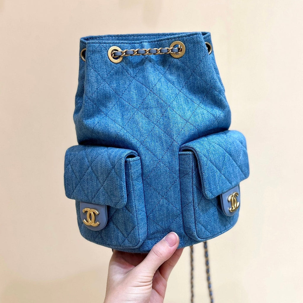 CHANEL DRAWSTRING BUCKET BACKPACK 24 IN MALIBU BLUE DENIM GOLD HARDWARE